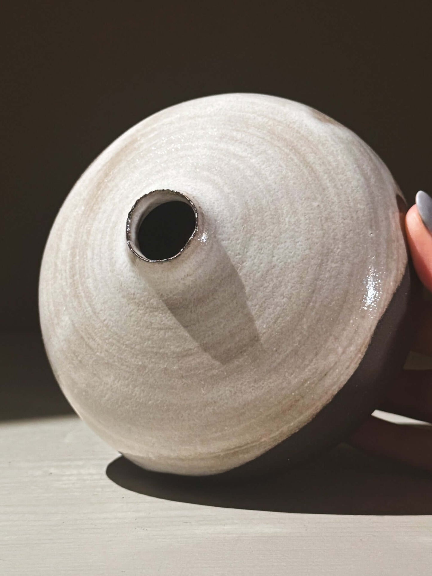 Orb Vase – Yuki Black #03 showcasing a unique spherical shape and organic glaze patterns.