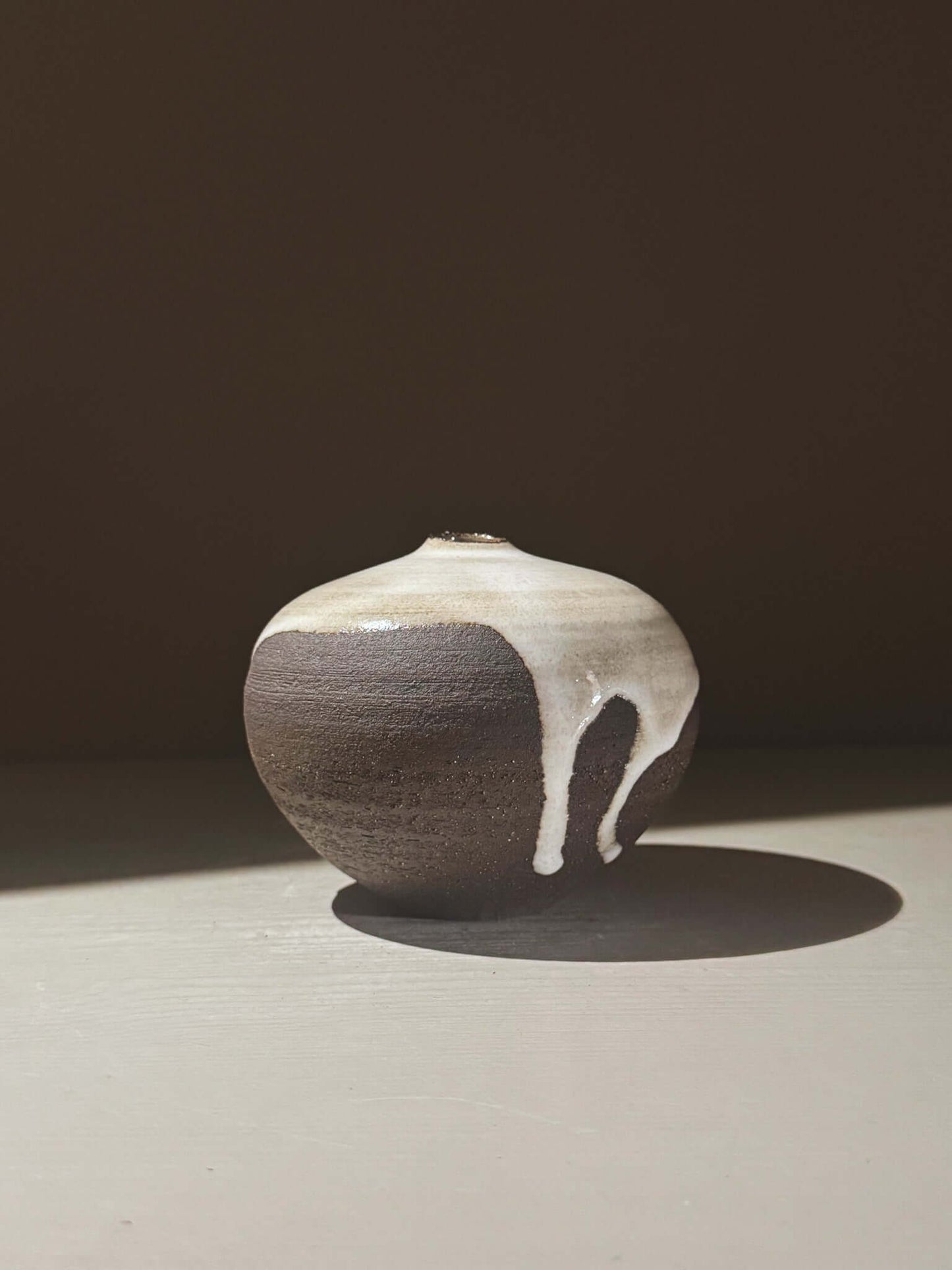 Orb Vase – Yuki Black #04 featuring a unique glaze with organic patterns and soft spherical shape.