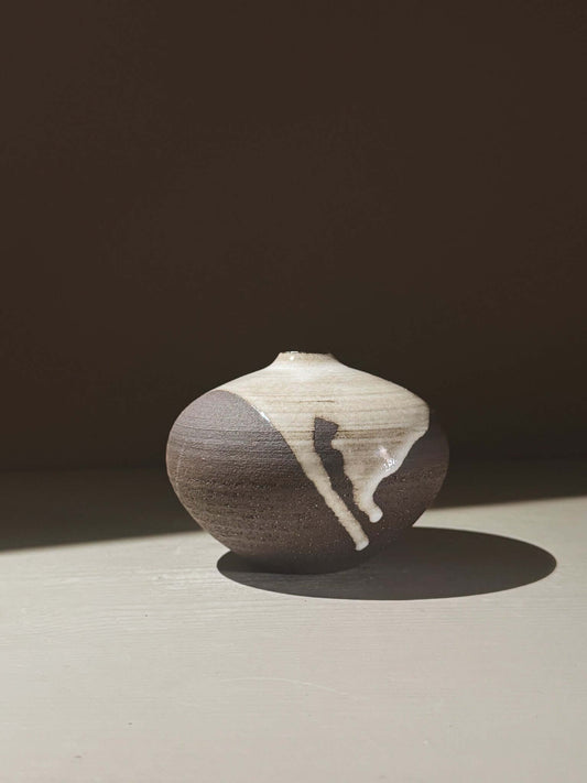 Orb Vase – Yuki Black #05 showcasing organic glaze patterns and rounded design, perfect for unique decor.