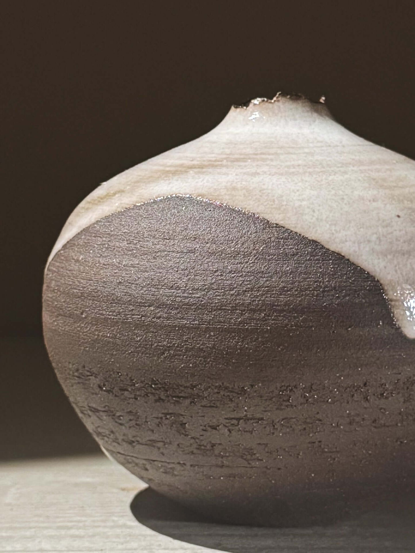 Orb Vase – Yuki Black #08 showcasing unique glaze movement and organic patterns in a rounded design.
