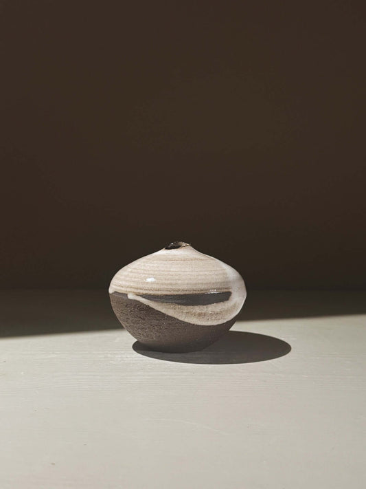 Orb Vase – Yuki Black #11 with organic glaze patterns and a sculptural spherical design.