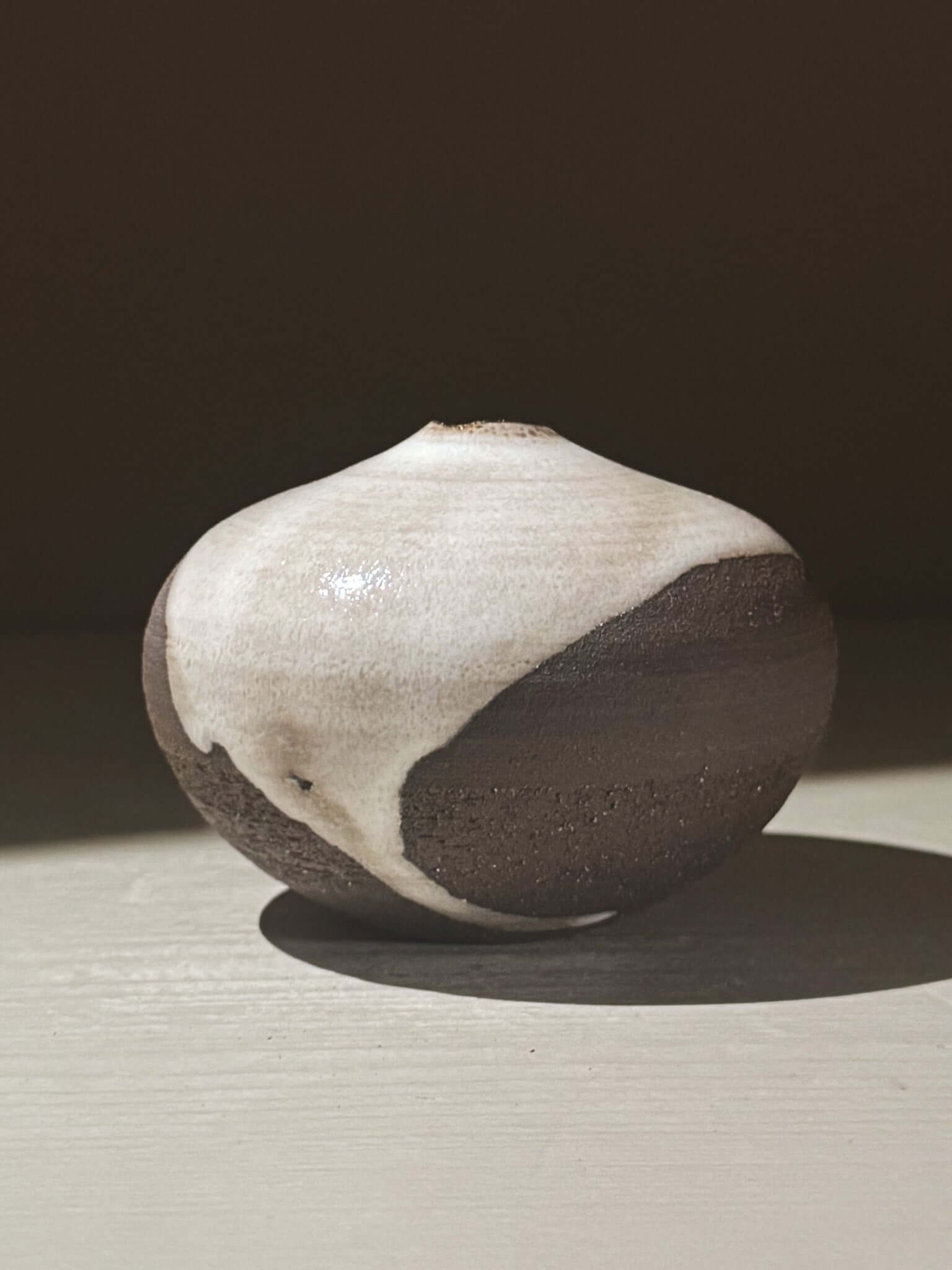 Orb Vase – Yuki Black #12 with unique glaze pattern and sculptural form showcasing organic design.