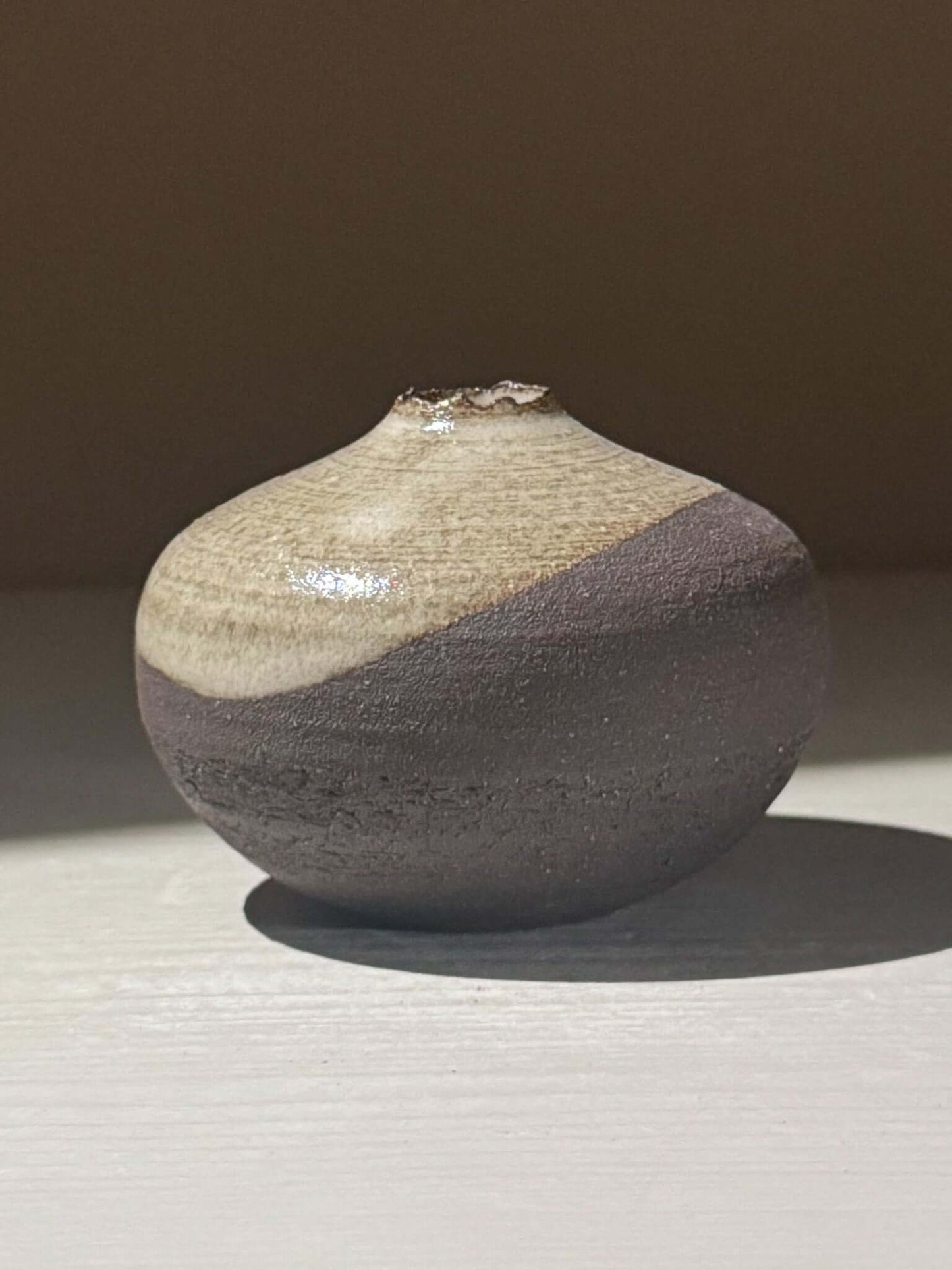 Orb Vase – Yuki Black #14 with unique glaze patterns and spherical form