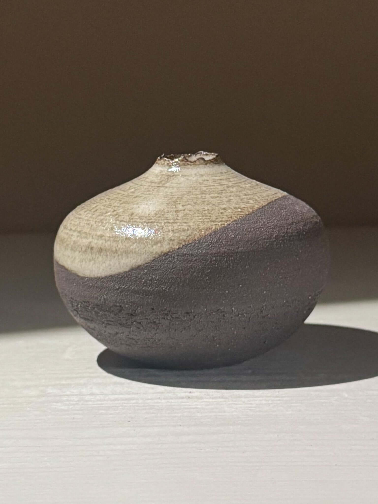 Orb Vase – Yuki Black #14 with unique glaze patterns and spherical form