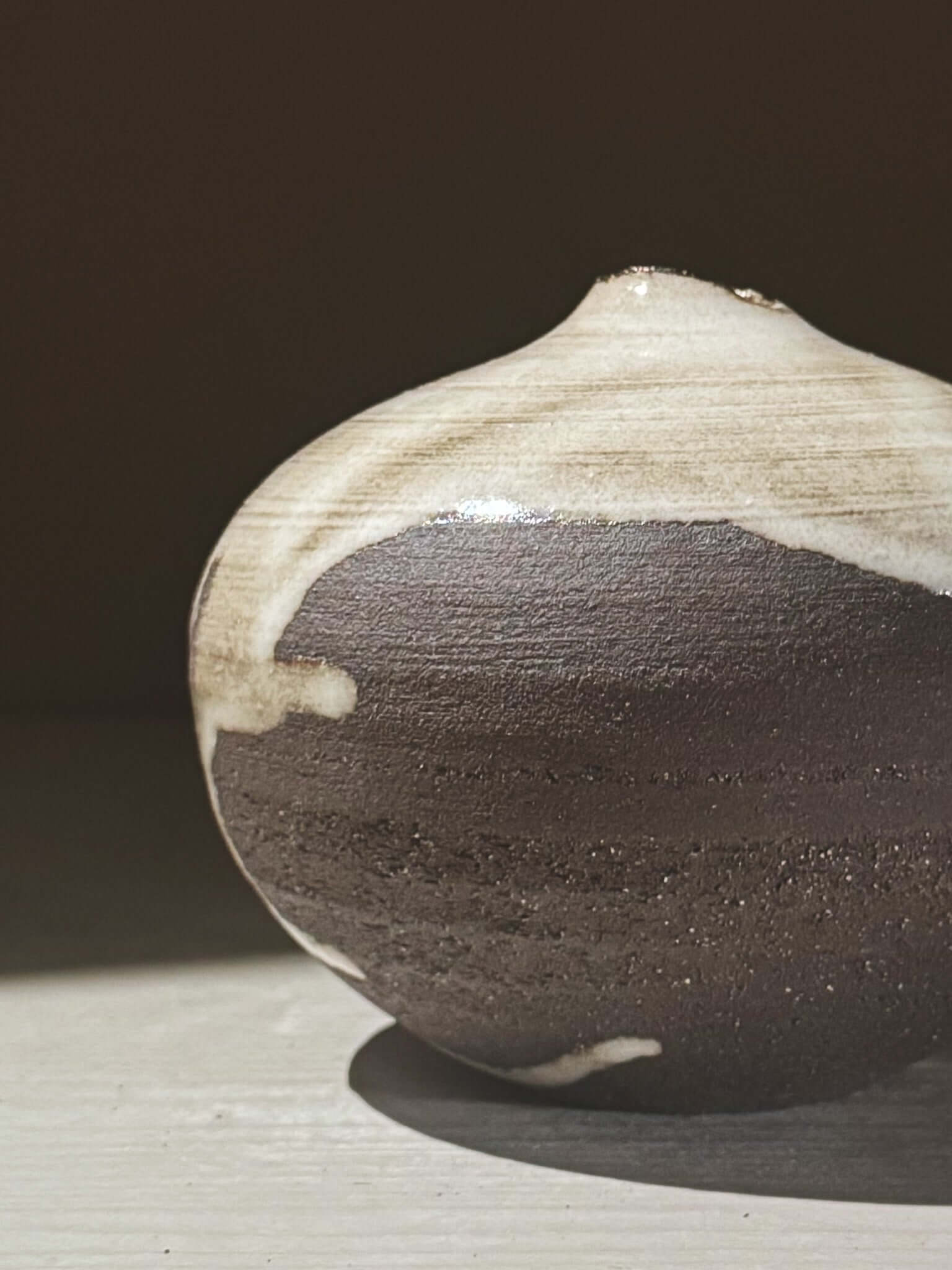 Orb Vase – Yuki Black #07 featuring a unique glaze with organic patterns and a soft spherical form.