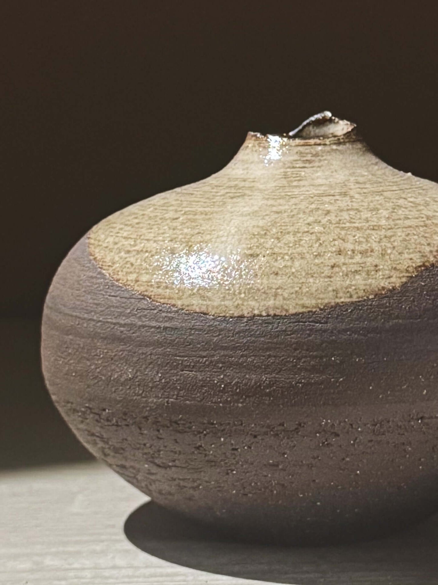 Orb Vase – Yuki Black #10 showcasing unique clay and glaze patterns with a calm, sculptural presence.