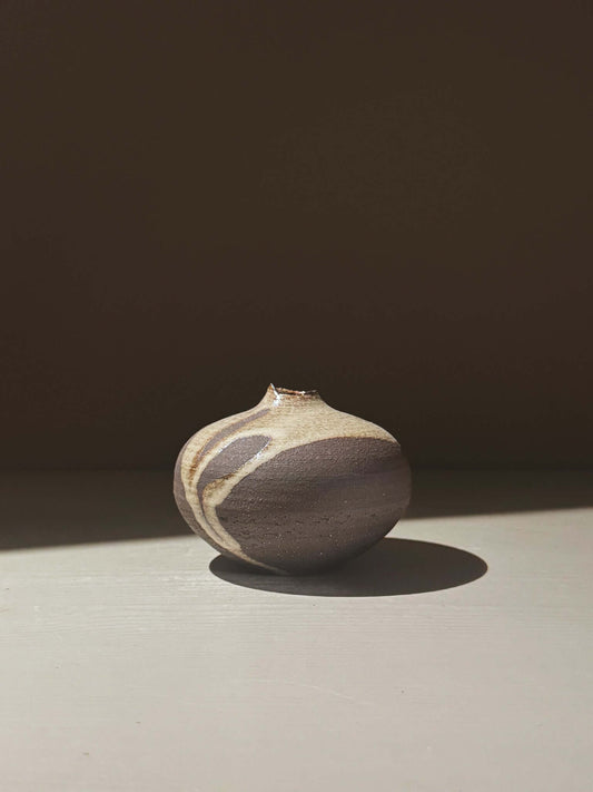Orb Vase – Yuki Black #10, unique clay vase with organic patterns and gentle glaze movement.
