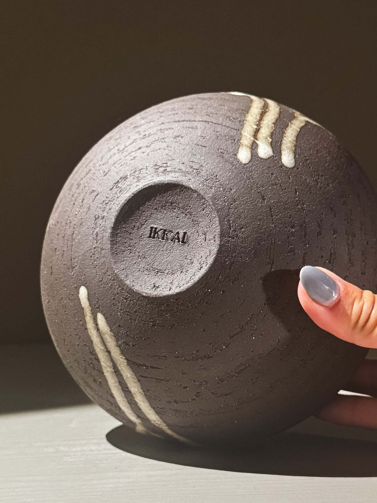 Orb Vase – Yuki Black #01 displayed with unique glaze patterns and hand detailing.