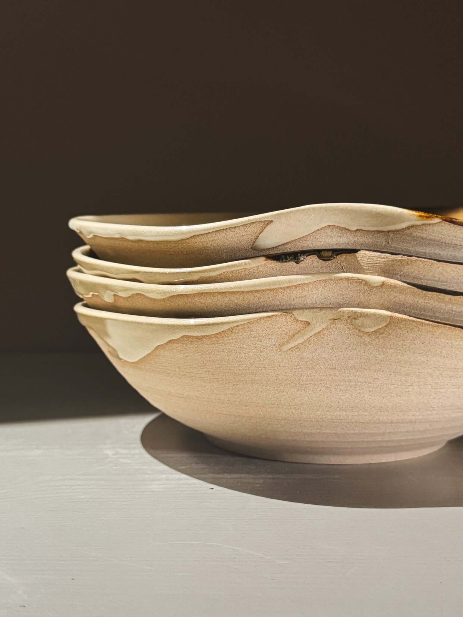 Handmade Salad/Pasta Plate – Inyo stacked in natural light, showcasing unique textures and glaze.