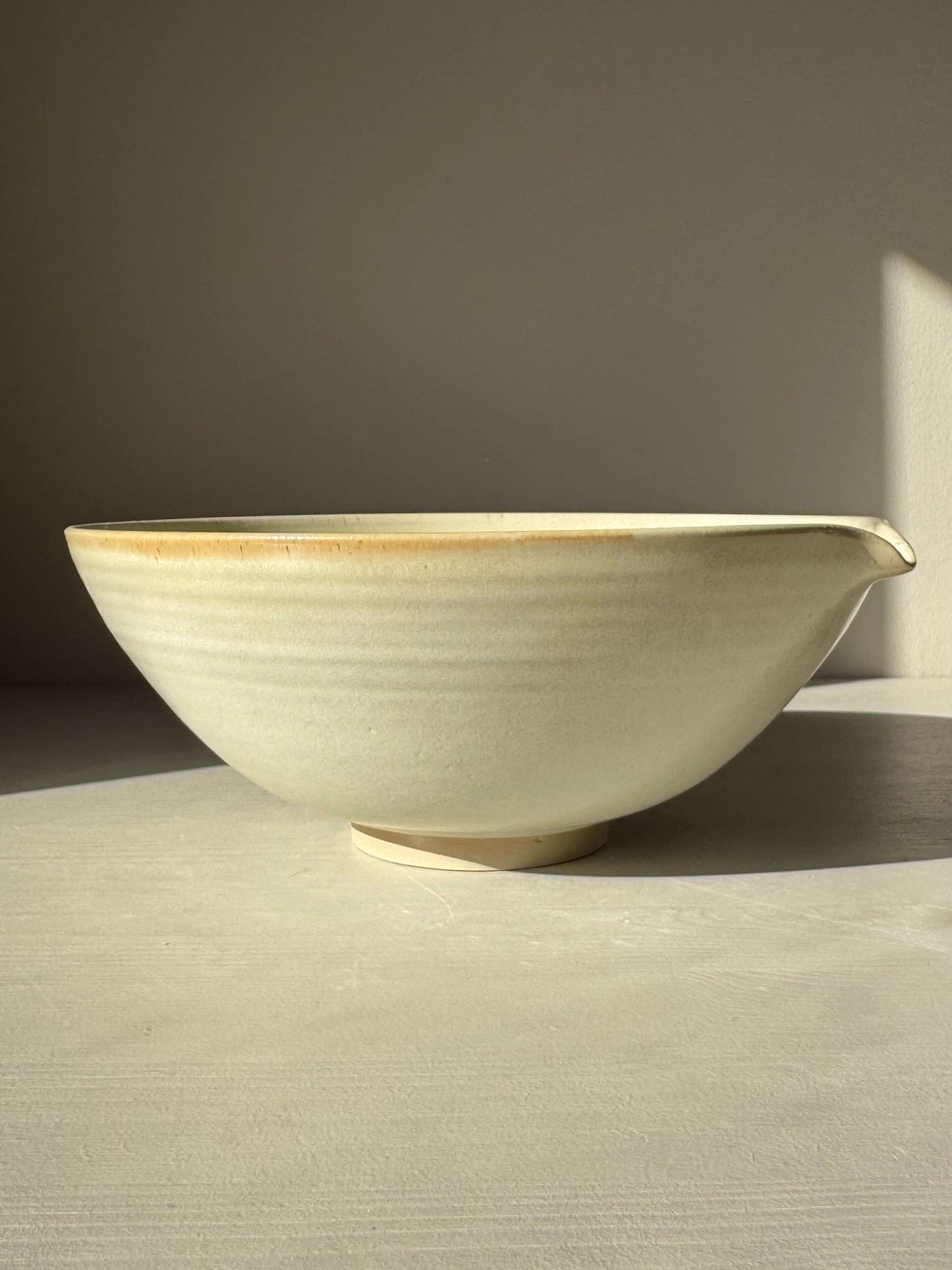Pouring Bowl – Moonstone handmade ceramic with soft creamy satin glaze and wide rim, medium size with carved spout, 10cm x 24.5cm.