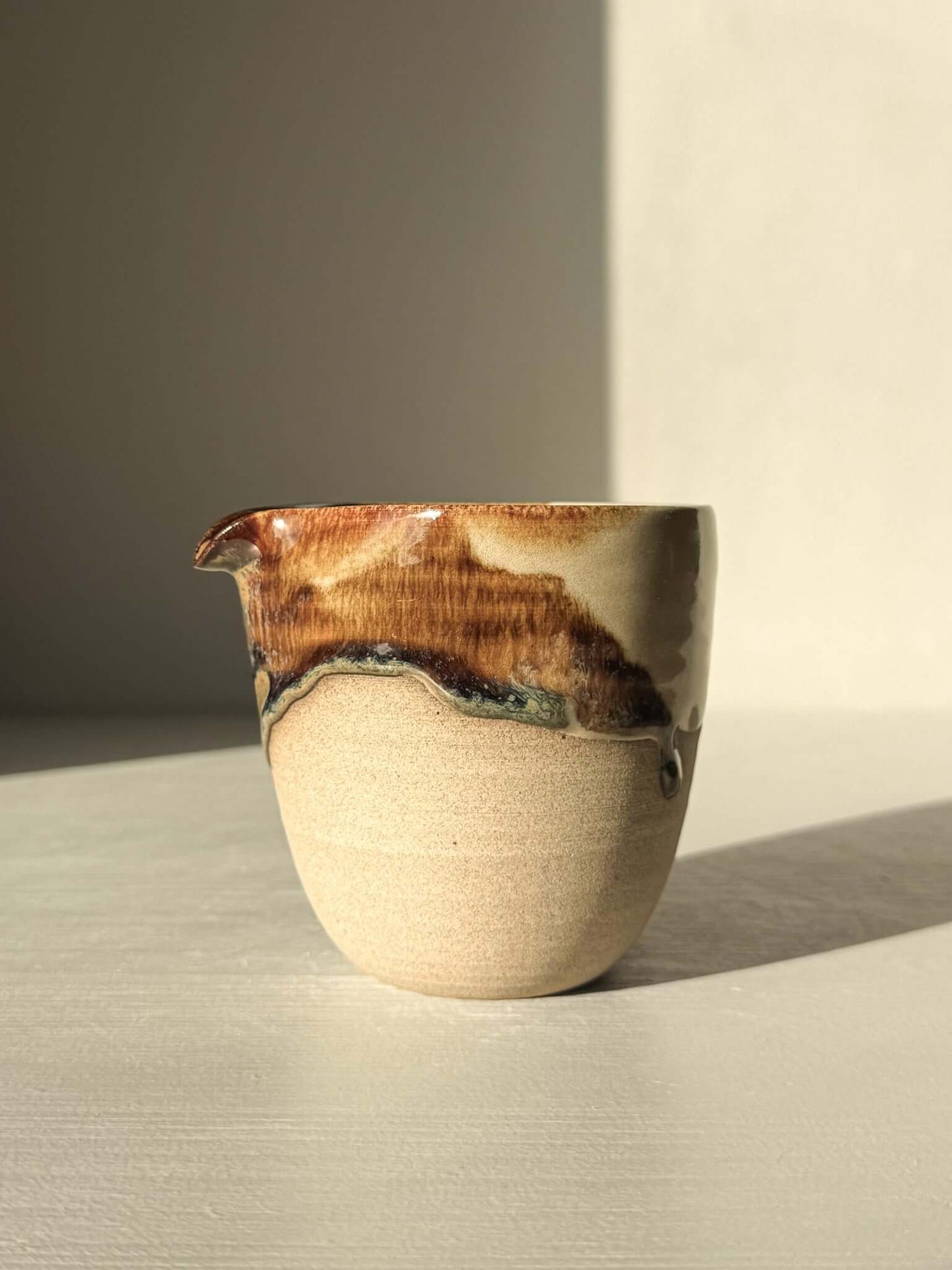 Pouring Jug – Inyo Series #01 handcrafted ceramic with glossy tenmoku and clear glaze, ideal for sauces or milk, elegant warm toffee clay.