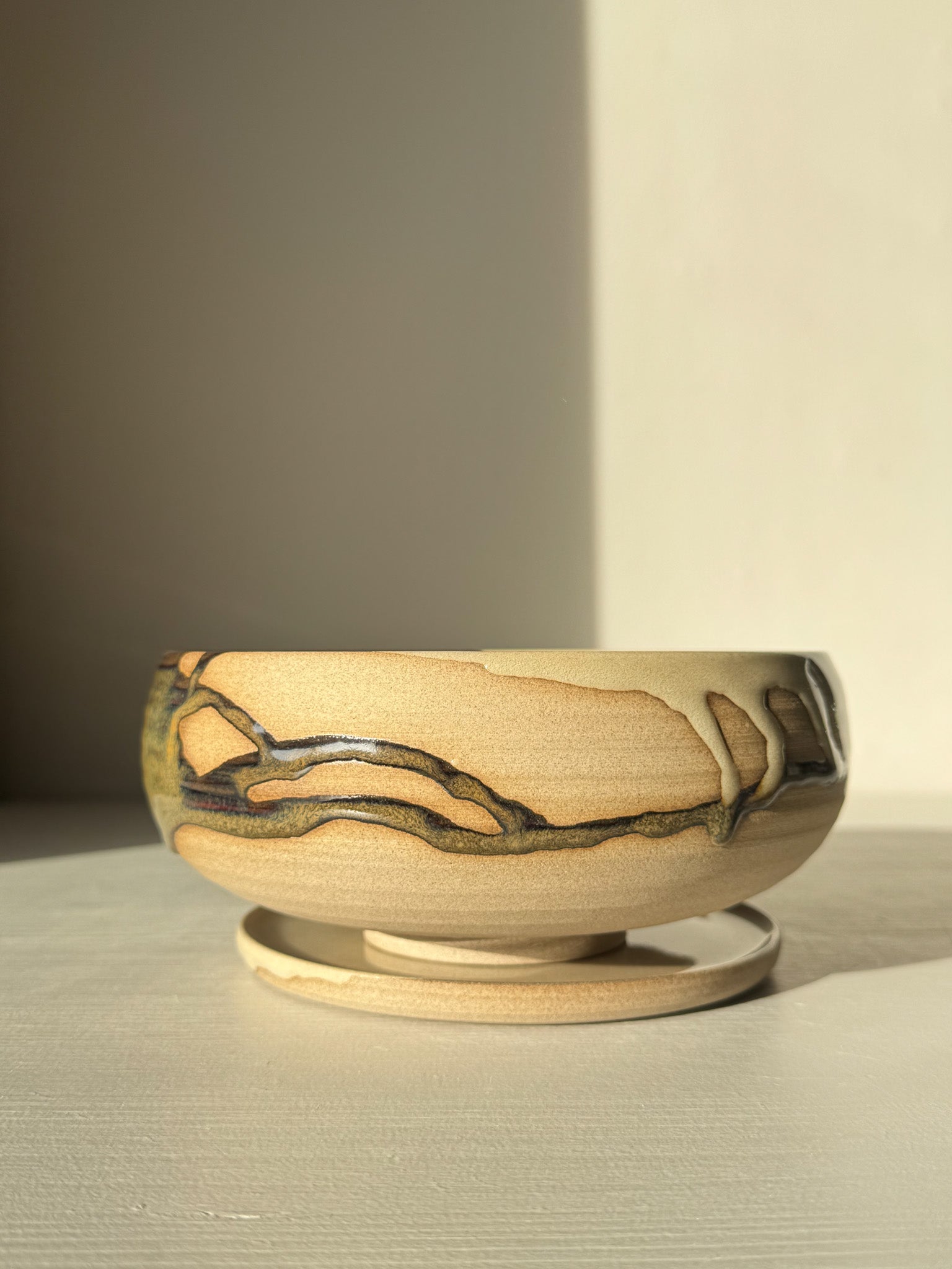 Rounded Berry Bowl - Inyo #02 with a drip plate, in earthy tones, ideal for serving fresh fruits, crafted with glossy tenmoku glaze.