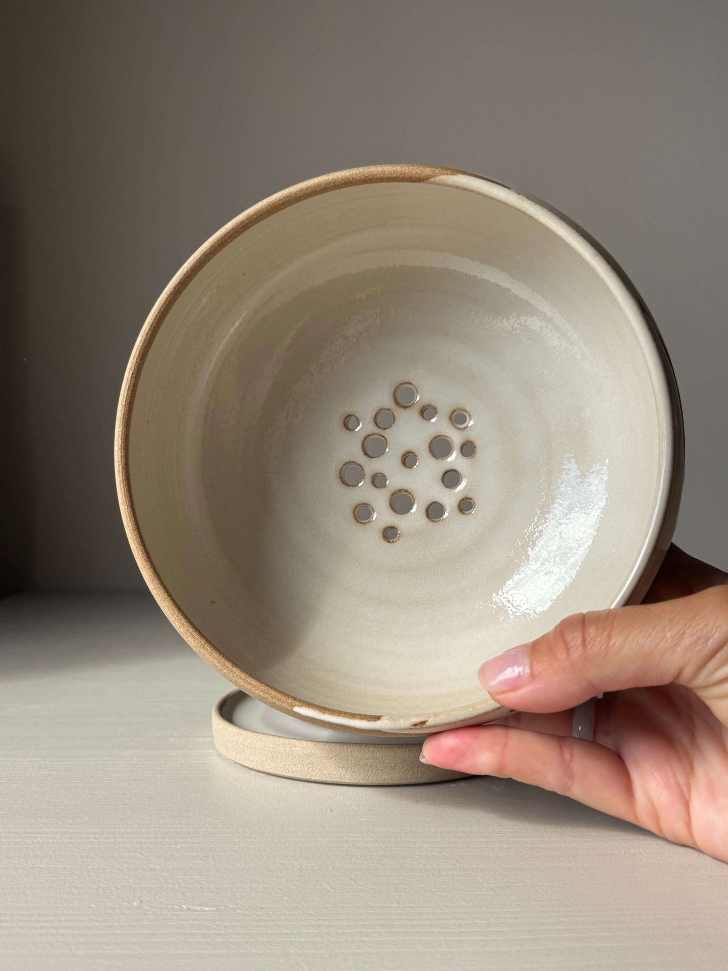 Handmade ceramic Rounded Berry Bowl - Yuki with white glaze and toffee clay for rinsing fruit and herbs, includes a matching drip plate.