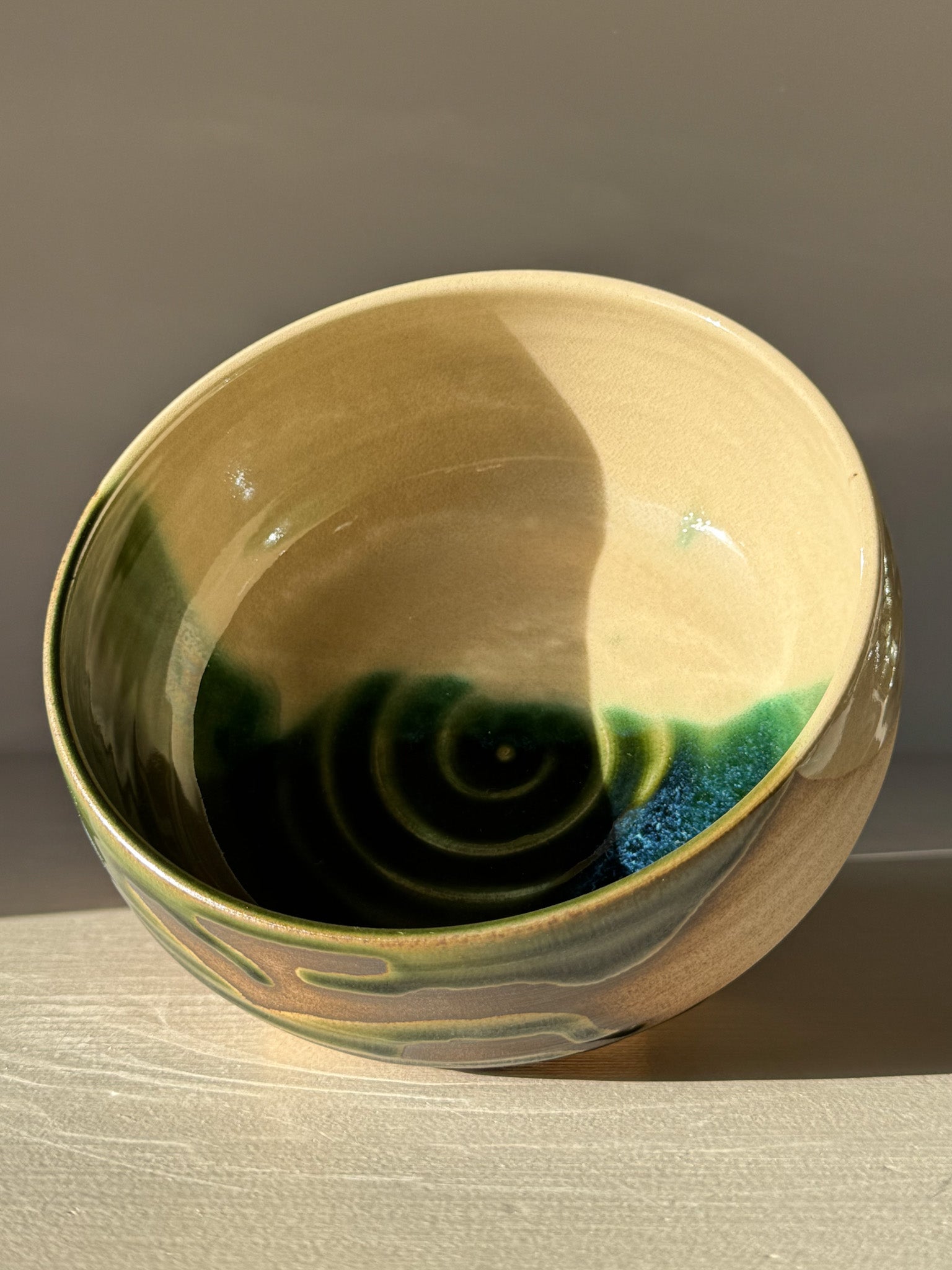 Rounded Breakfast Bowl – Mori with flowing green and clear glaze on toffee clay, perfect for granola, soup, and rice dishes.