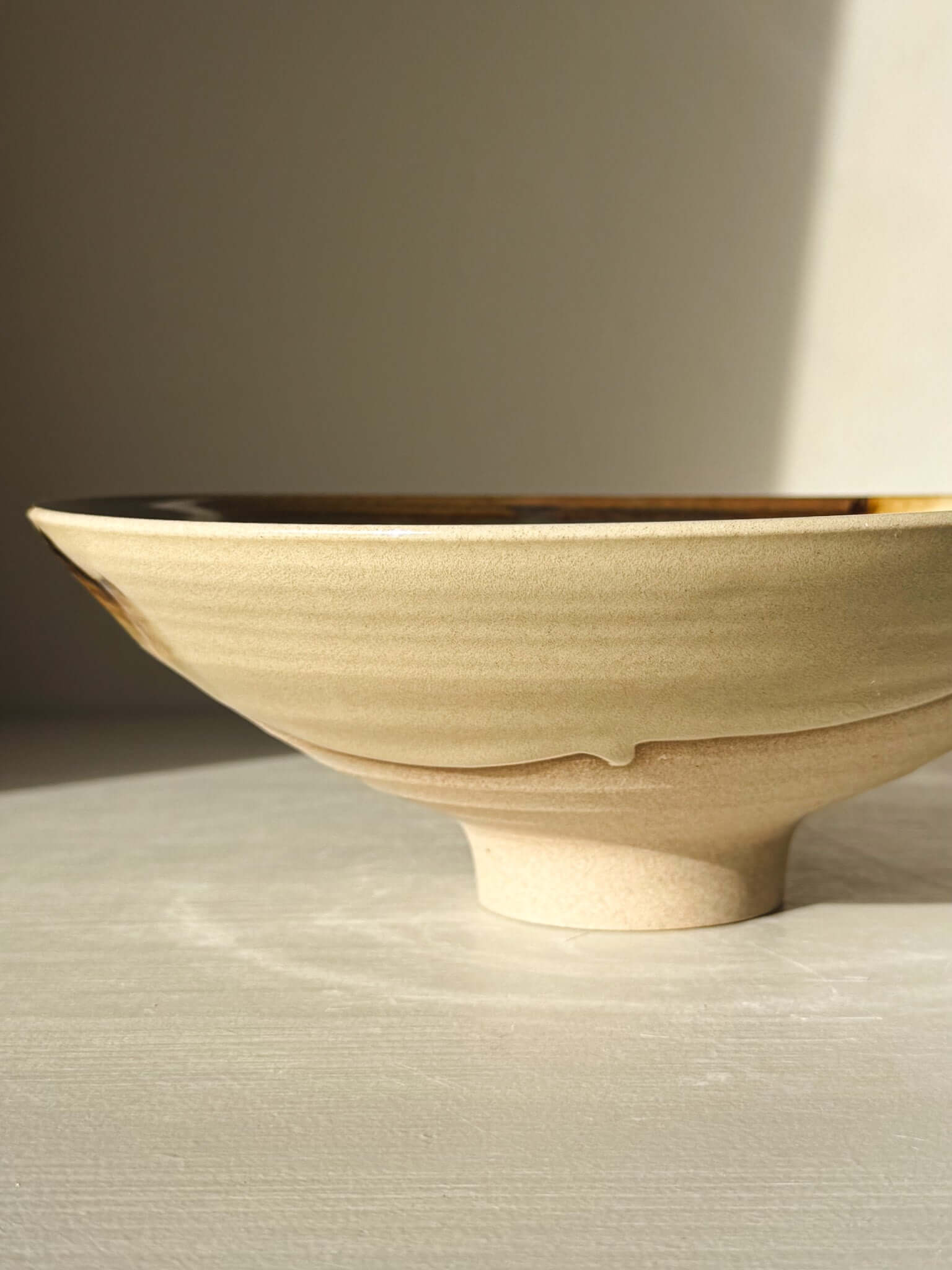 Serving Bowl - Inyo Series #01 handmade ceramic with tenmoku and amber glaze, showcasing a unique and natural color contrast.