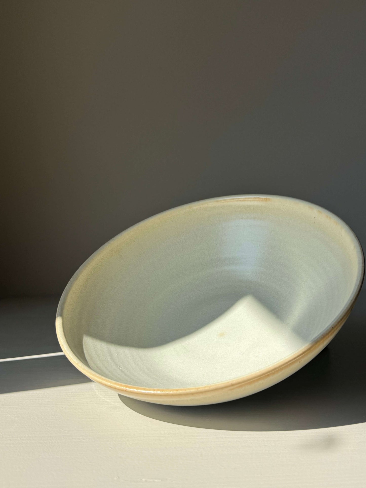 Shallow Dish - Moonstone, handmade ceramic with moonstone glaze, showcasing subtle tone variations in a shallow design.