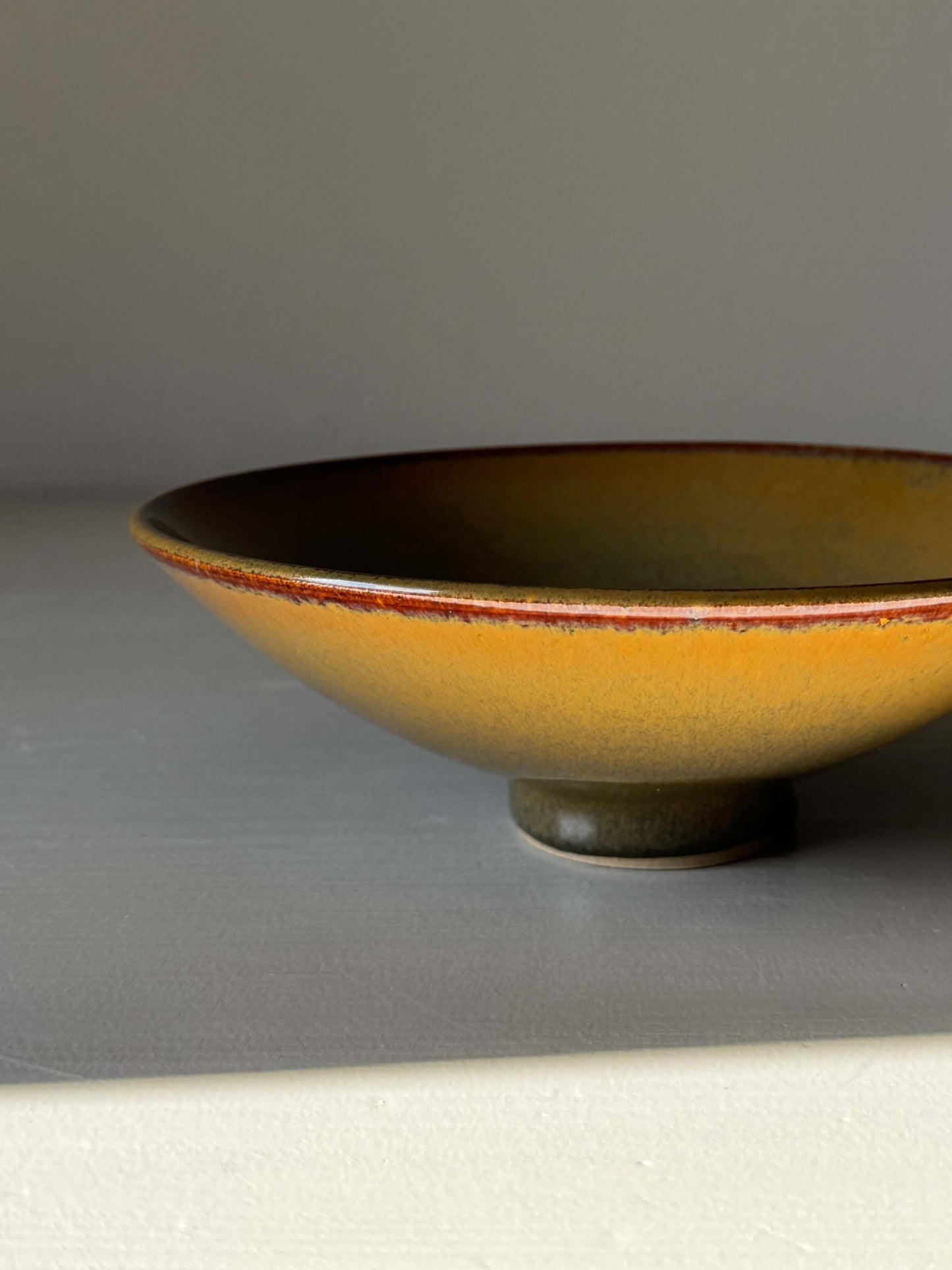Shallow Dish - Tenmoku Glaze, handmade ceramic with golden amber and warm brown hues, perfect for serving or display.