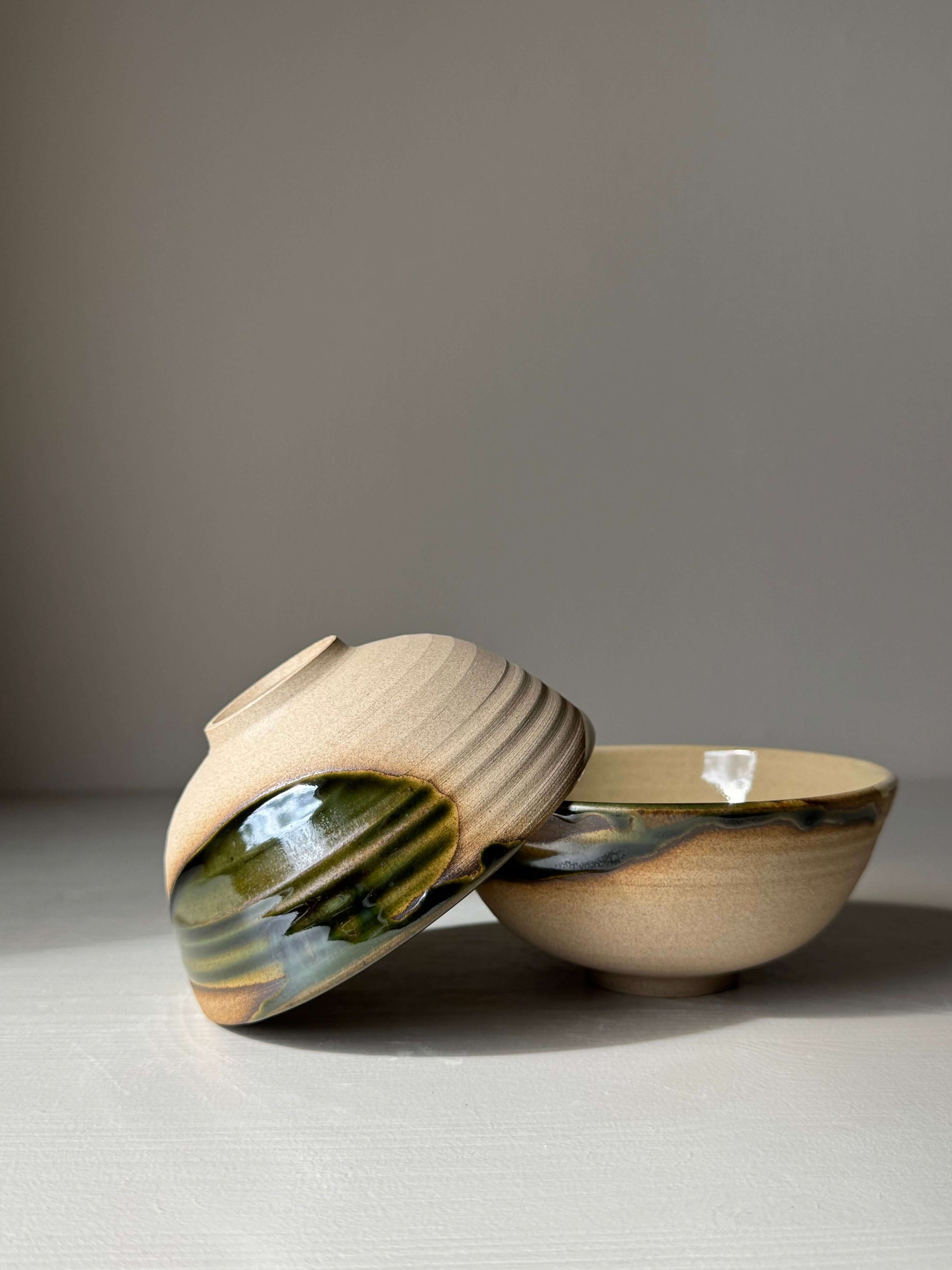 Alt Tag: Small Bowl - Mori Series, handmade ceramic with unique green glaze flowing over rim, inspired by forest tranquility.