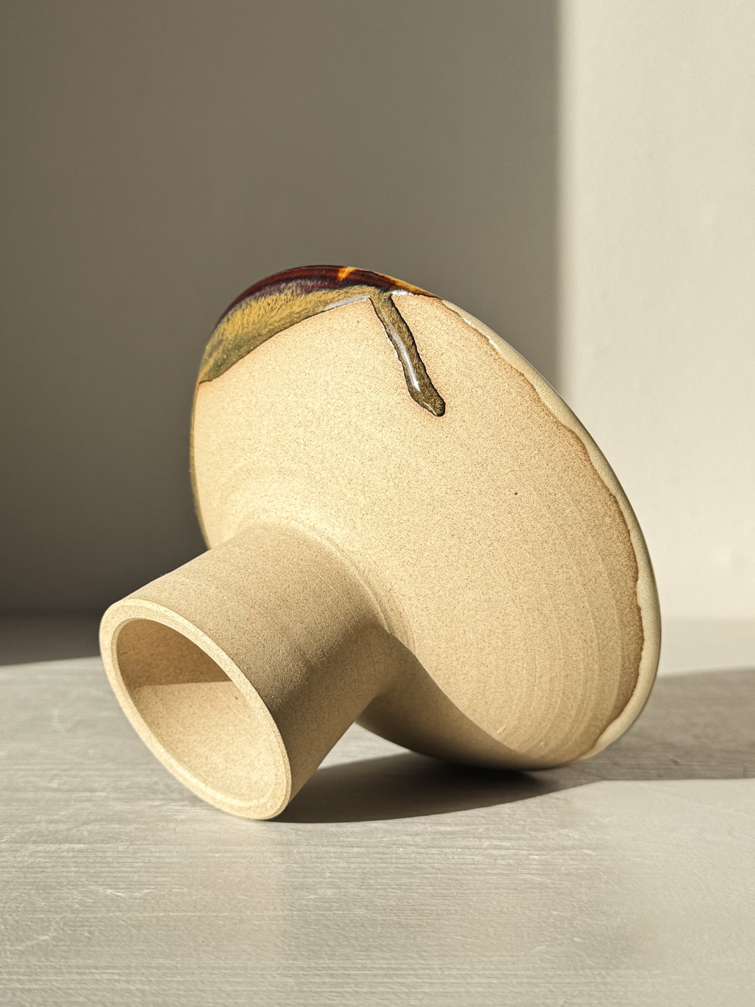 Small Pedestal Bowl - Inyo #01, sculptural design with glaze in gold, brown, blue, and green, highlighting unique craftsmanship.