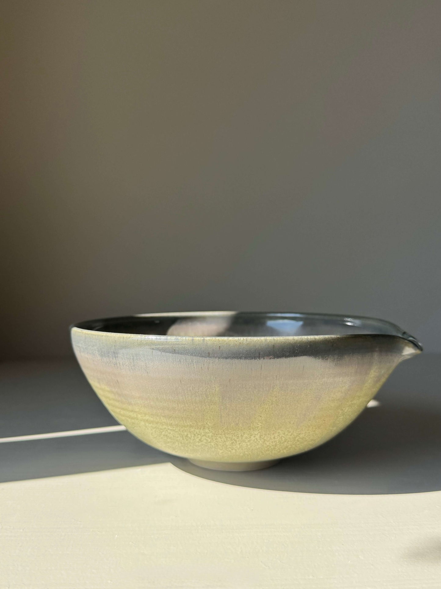 Small Pouring Bowl – Satin Blue handmade ceramic with spout, 17 cm diameter, satin finish showcasing olive green to smoky blue-grey gradient.