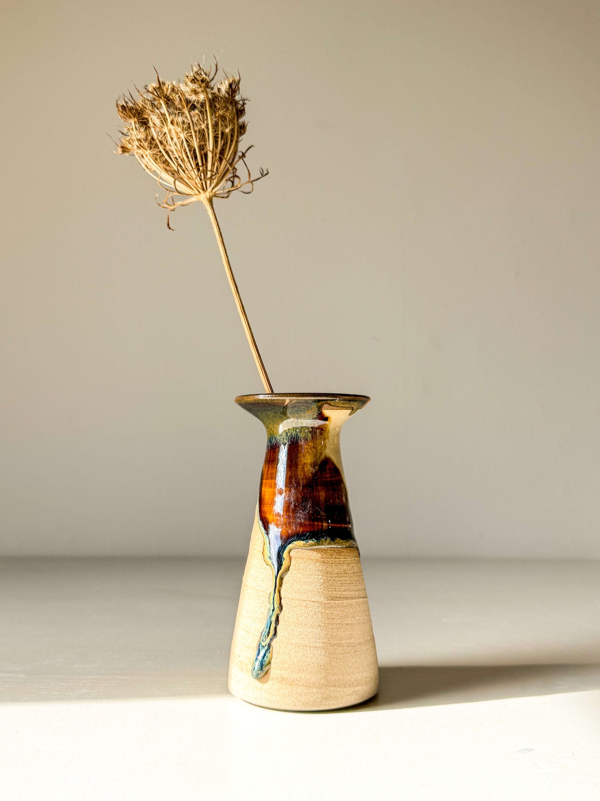 Small Vase – Inyo #01 handmade ceramic with unique glaze, sculptural silhouette, tall flared shape, showcasing artisanal craftsmanship.