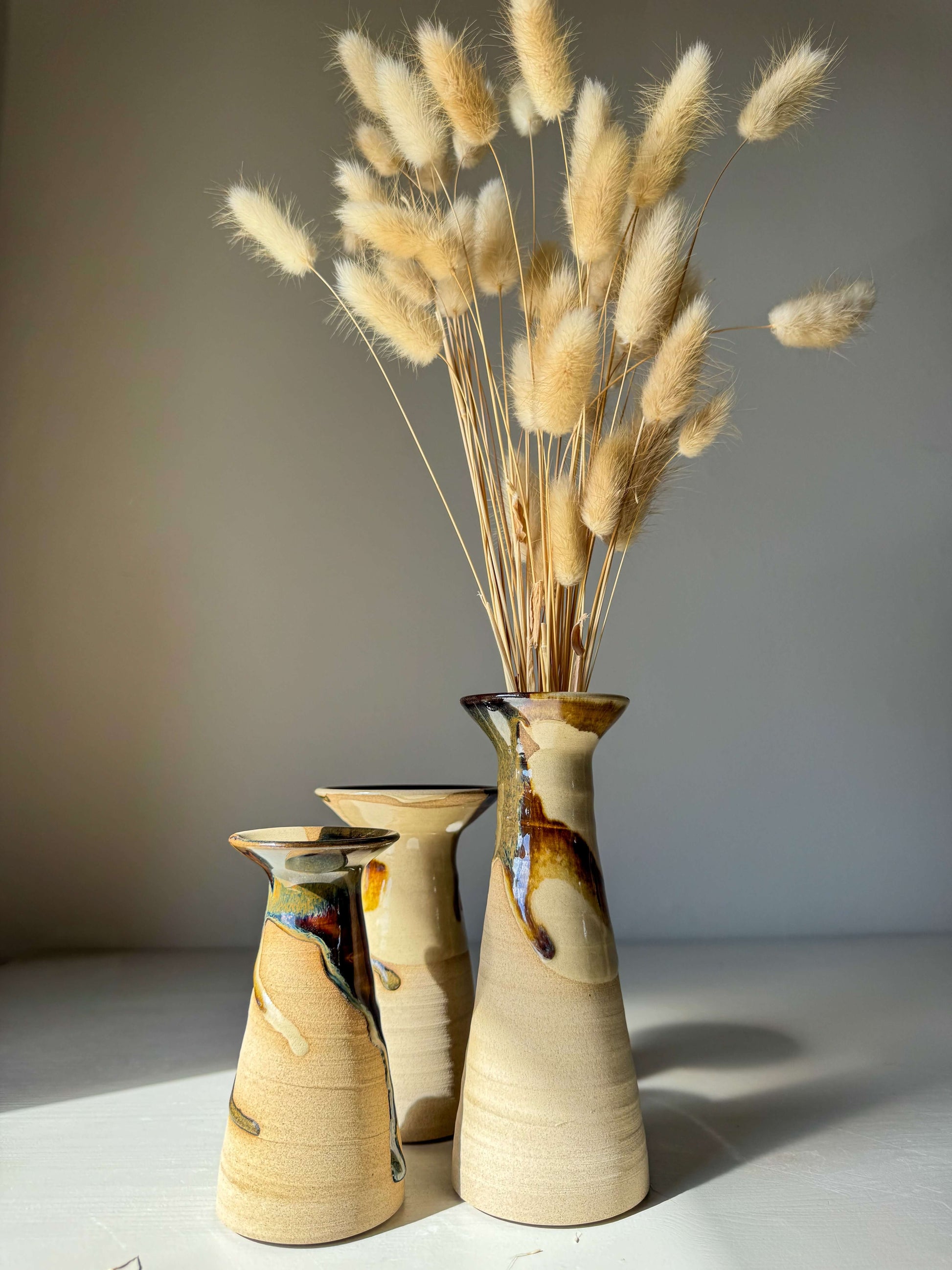 Handmade ceramic Small Vase – Inyo #01 with unique glaze in sculptural silhouette, shown with decorative dried grasses.