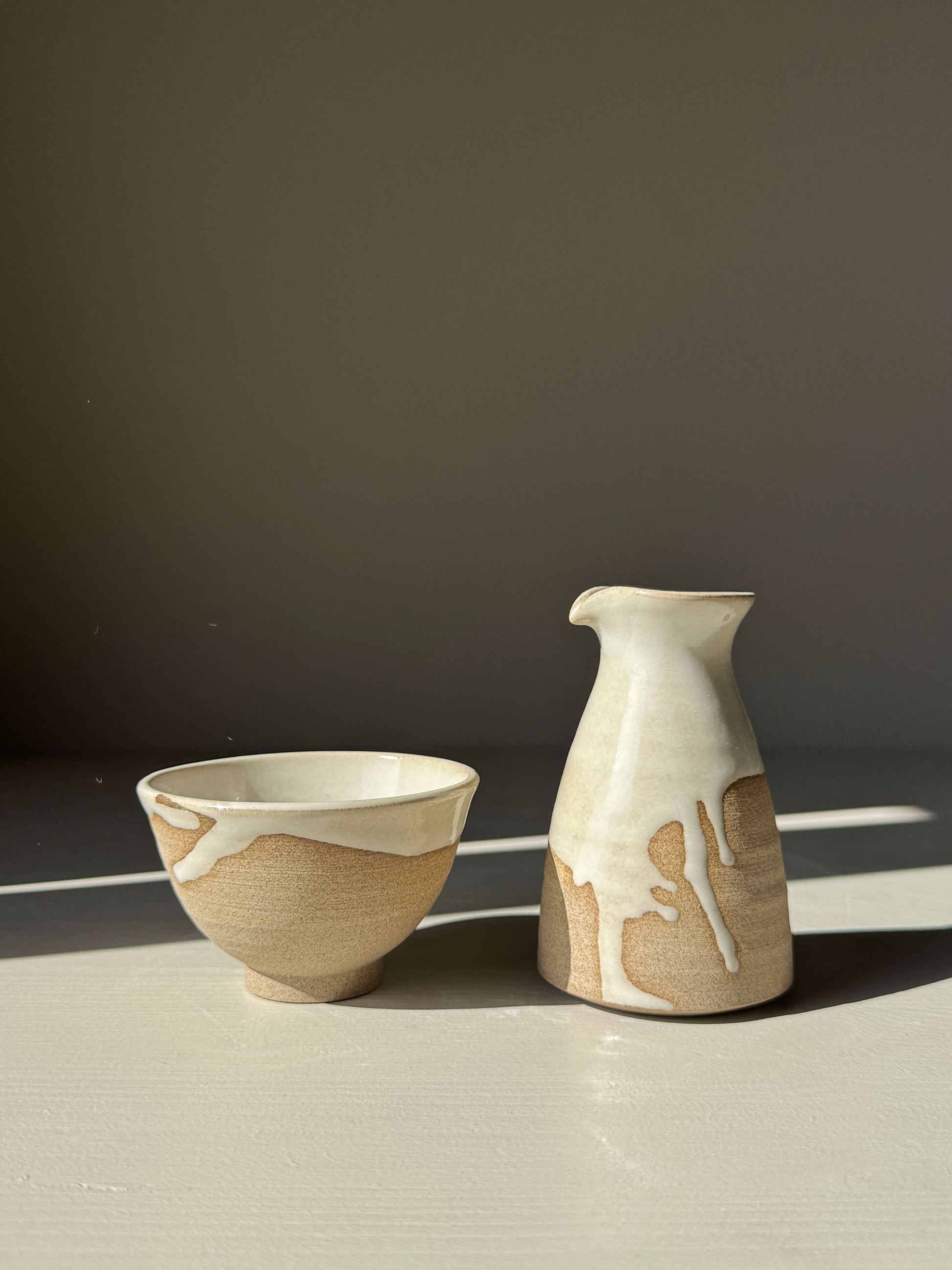 Handmade ceramic Soya Pourer - Yuki with textured toffee clay and white glaze, enhancing elegant table settings.