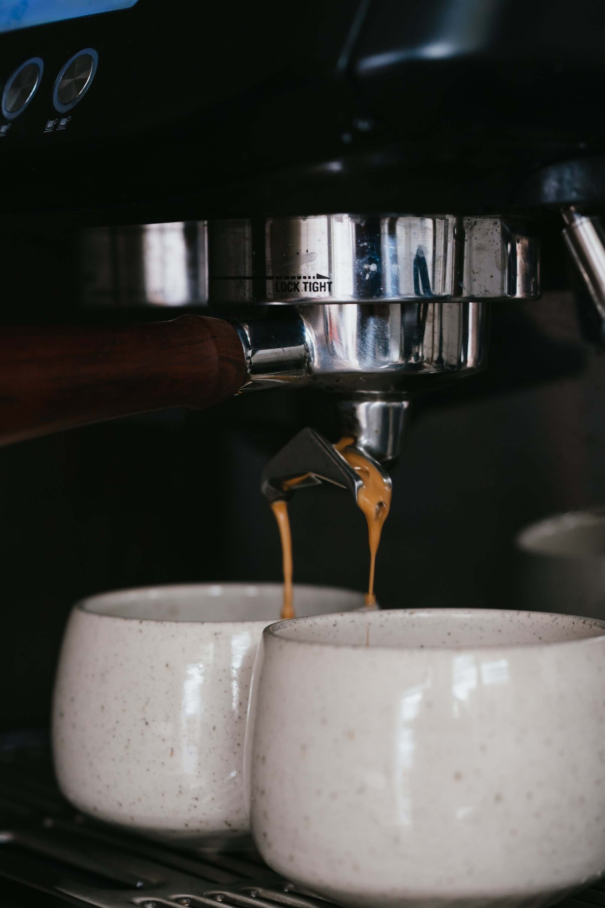 Cups - Speckled Clear Glaze capturing espresso under a coffee machine, highlighting handmade ceramic craftsmanship.