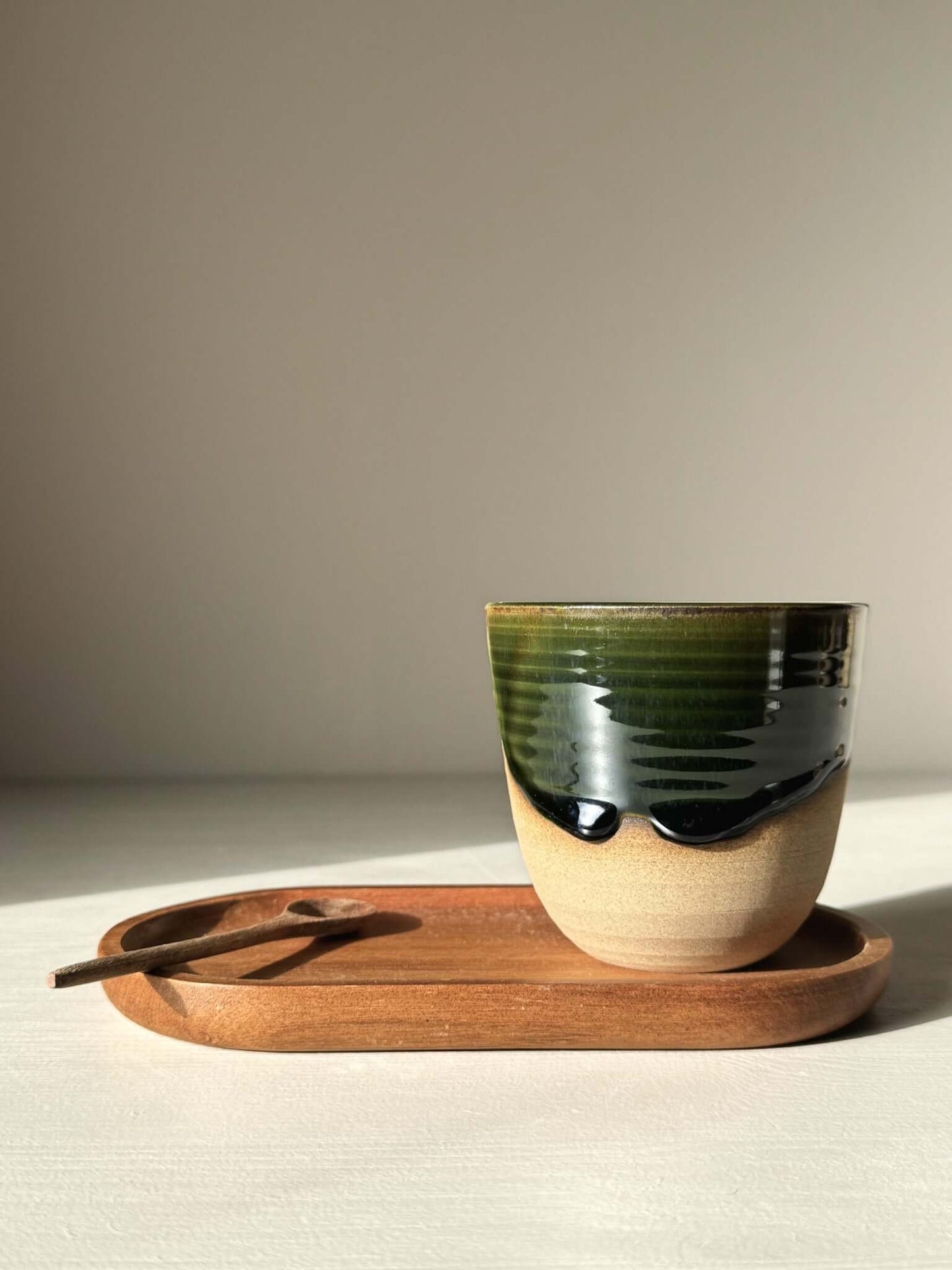 Handcrafted Stackable Latte Cups - Mori with green and clear glazing on wooden tray
