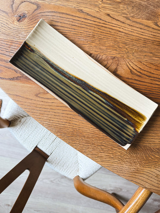 Handcrafted Sushi Plate – Inyo #01 with tenmoku glaze on a wooden table