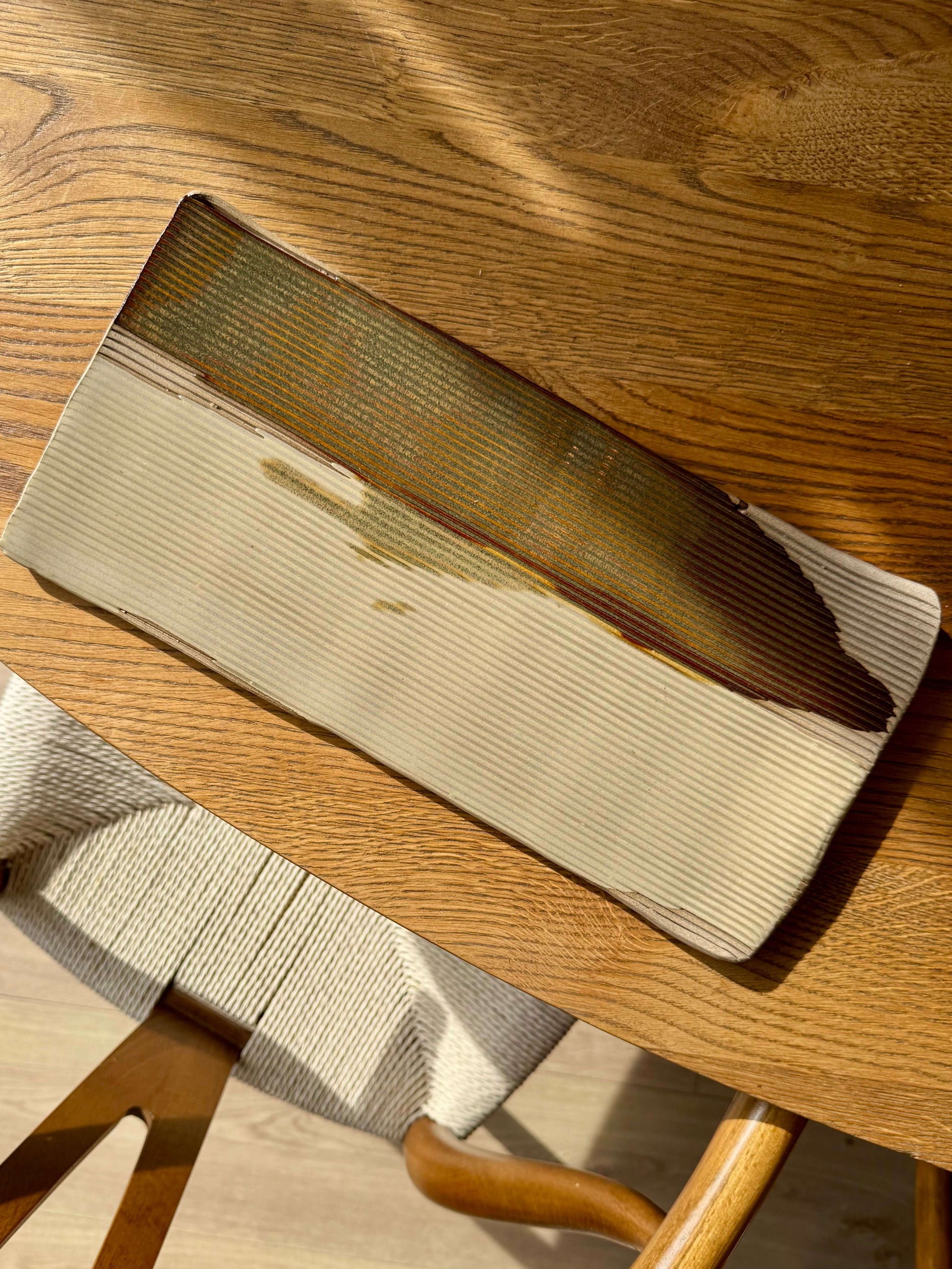 Handmade ceramic Sushi Plate – Inyo Series #02 with a structured, sculptural design and textured tenmoku and clear glaze finish.