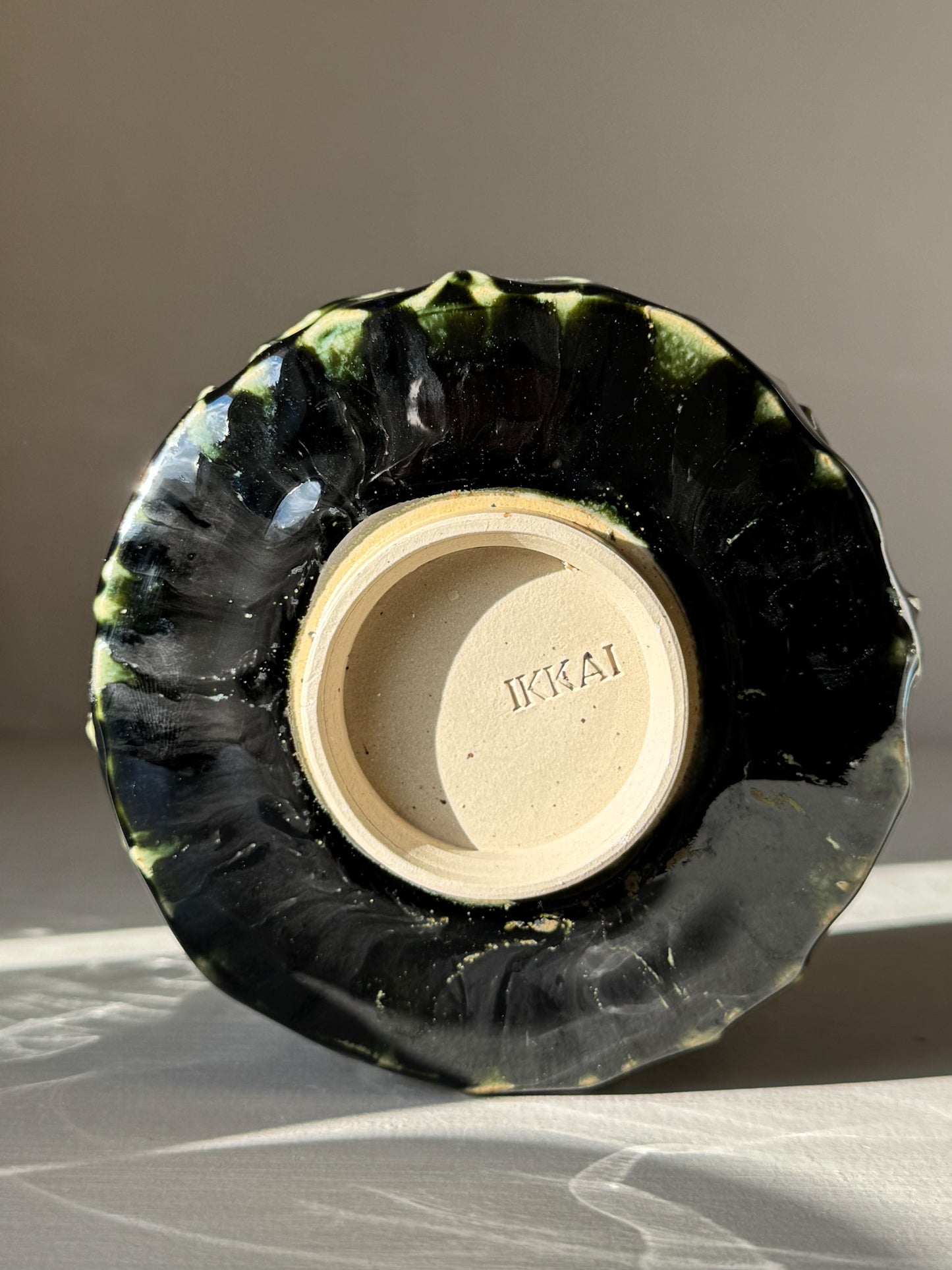 Bottom view of Textured Matcha Bowl - Hinoki #07 with green glaze and natural finish, part of the Hinoki Series.