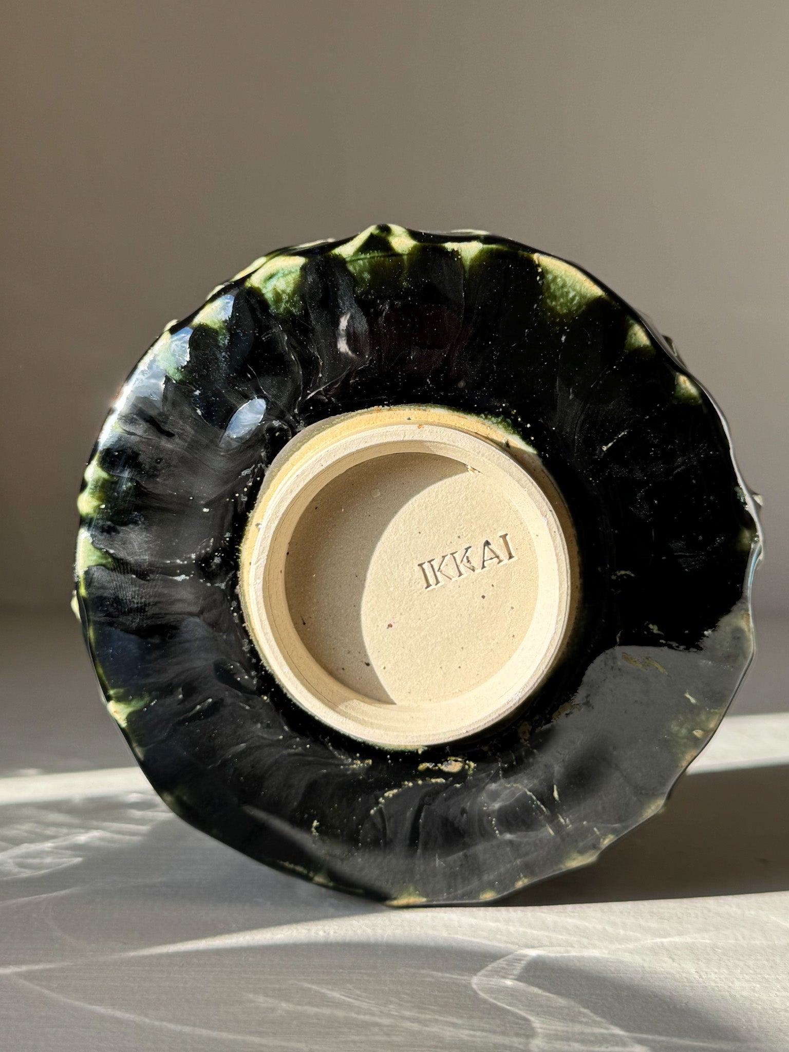 Bottom view of Textured Matcha Bowl - Hinoki #07 with green glaze and natural finish, part of the Hinoki Series.