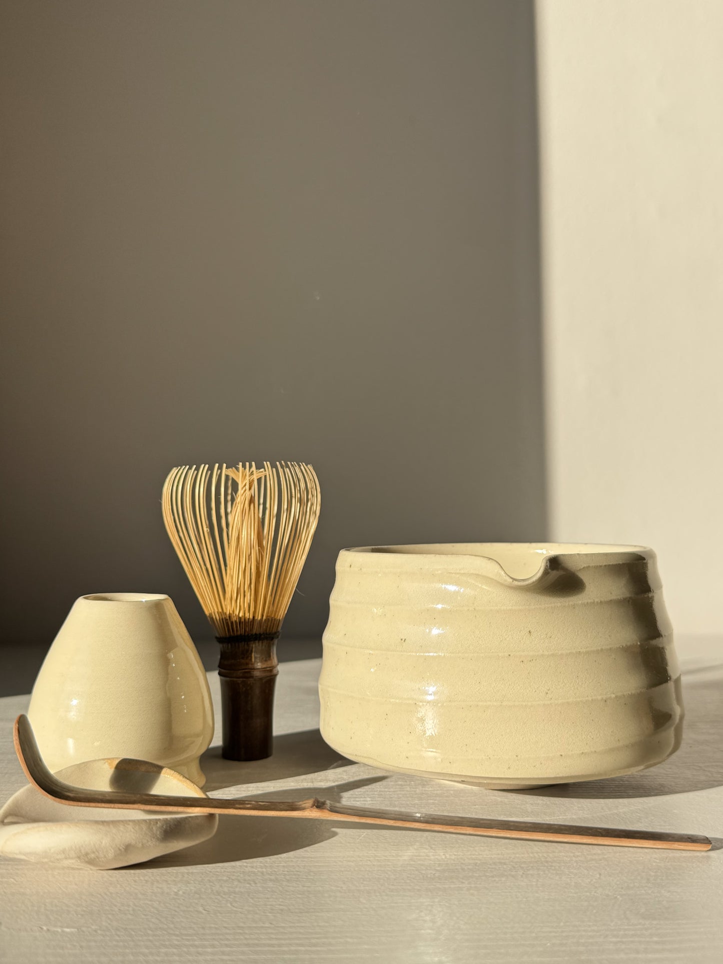 Textured Matcha Bowl Spout - Clear #02 with whisk, spoon, and accessory under natural light