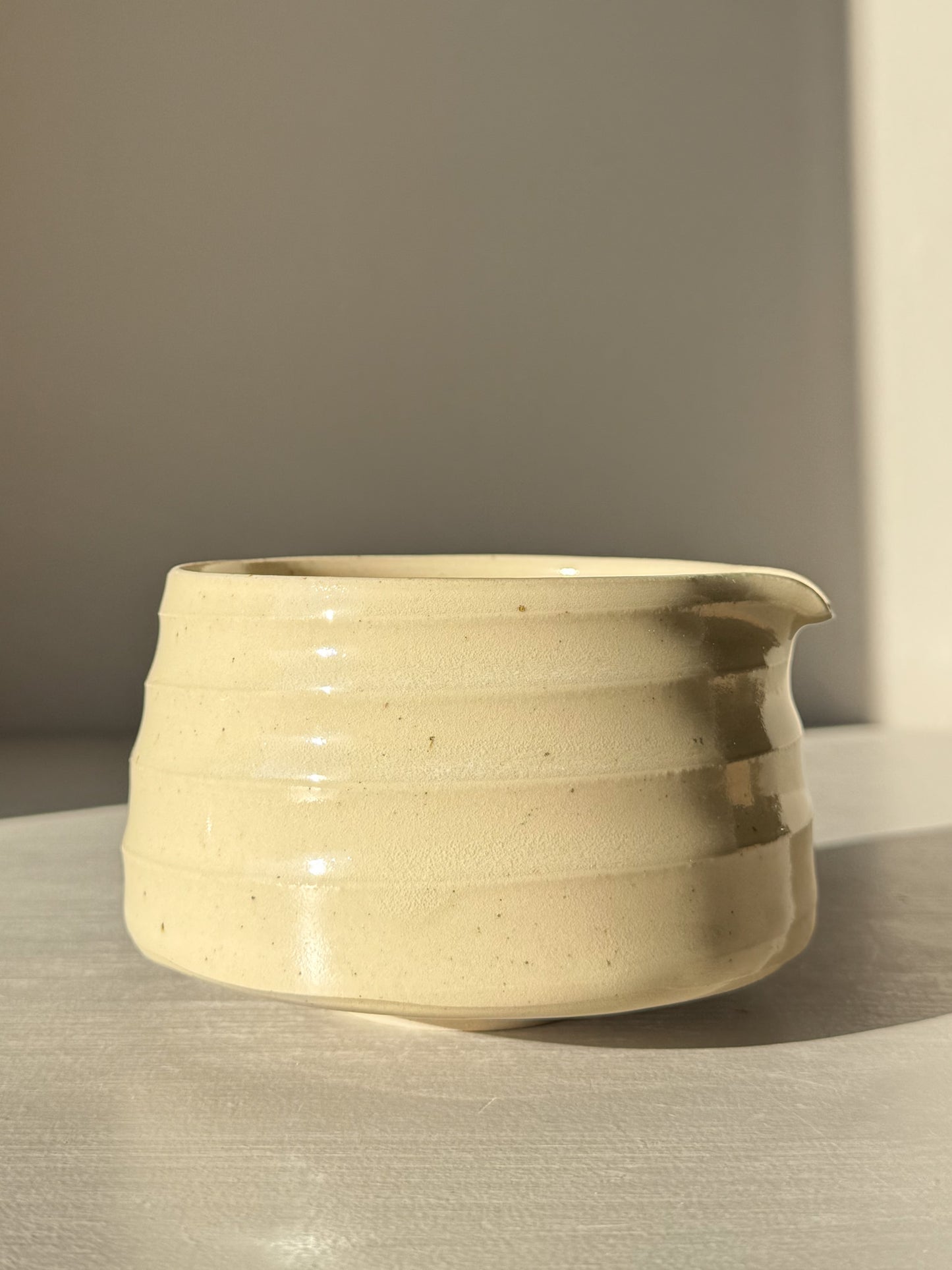 Textured Matcha Bowl Spout - Clear #02 with glossy glaze highlighting stoneware texture and pouring spout for easy serving.