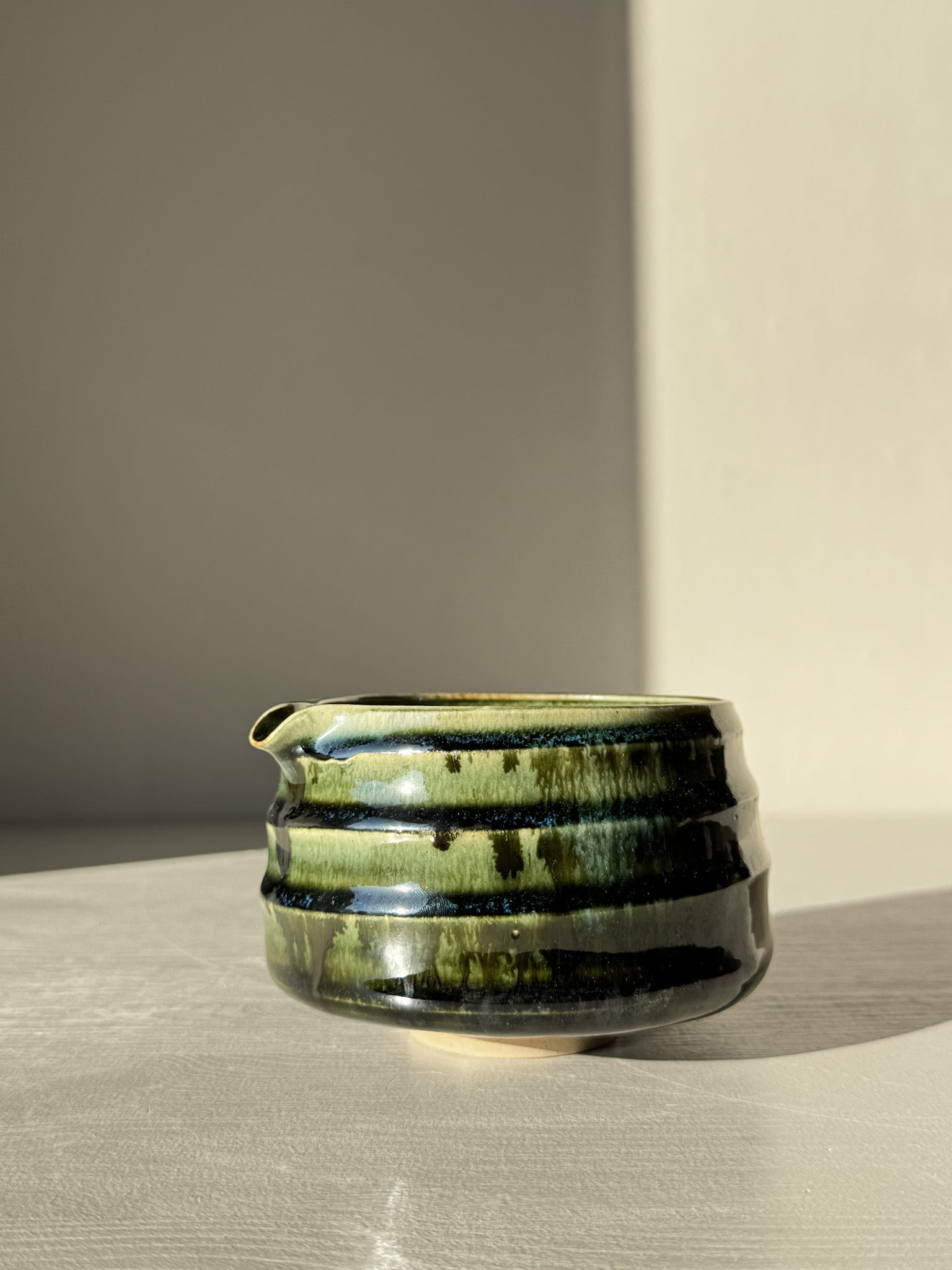 Textured Matcha Bowl Spout - Hinoki #04 in glossy green glaze with pouring spout and subtle ridges, enhancing tactile feel and aesthetics.