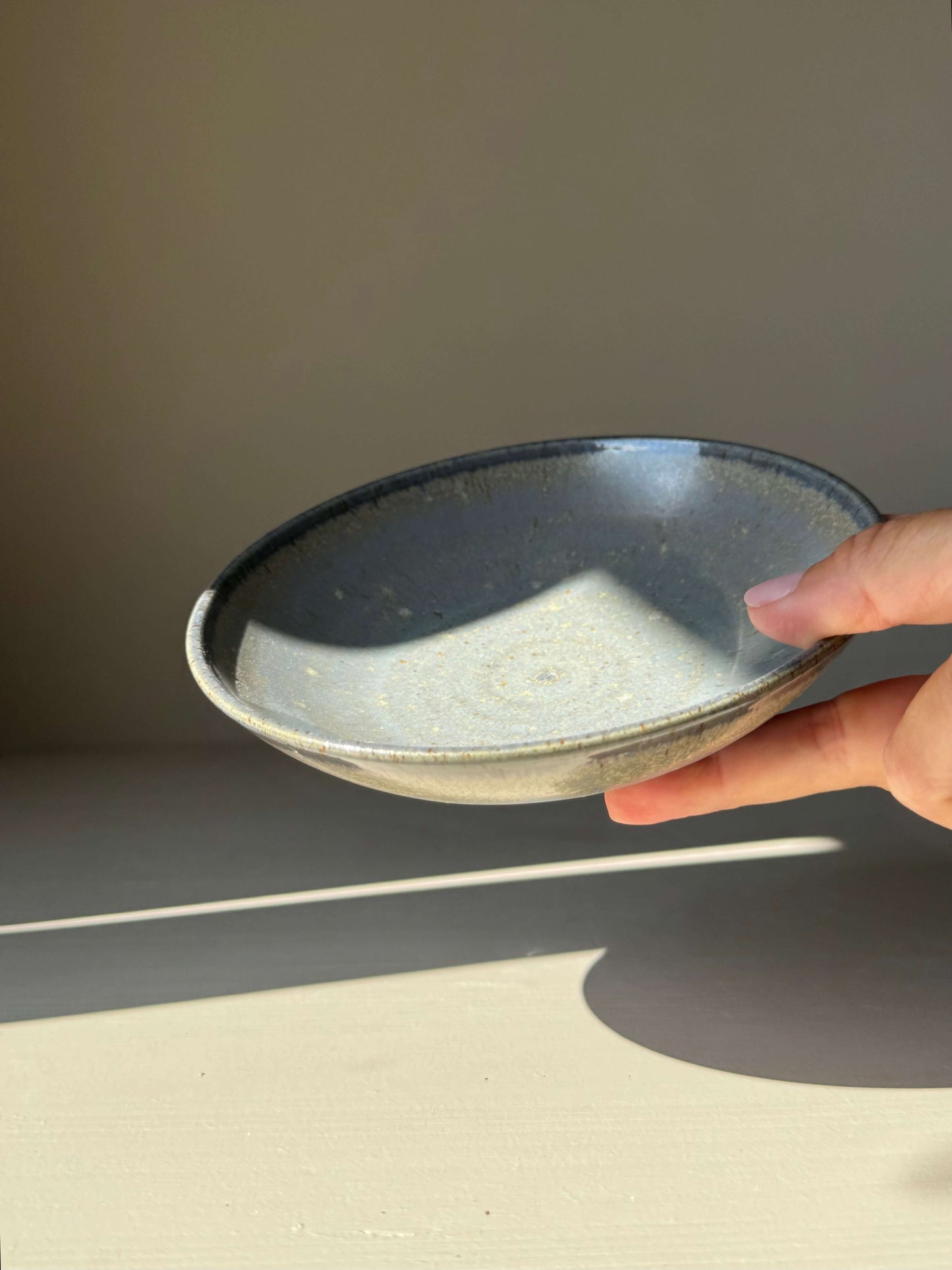 "Trinket Dish - Satin Blue, handmade ceramic, 15 cm diameter, shallow dish with raised foot in satin blue glaze, elegant and versatile."