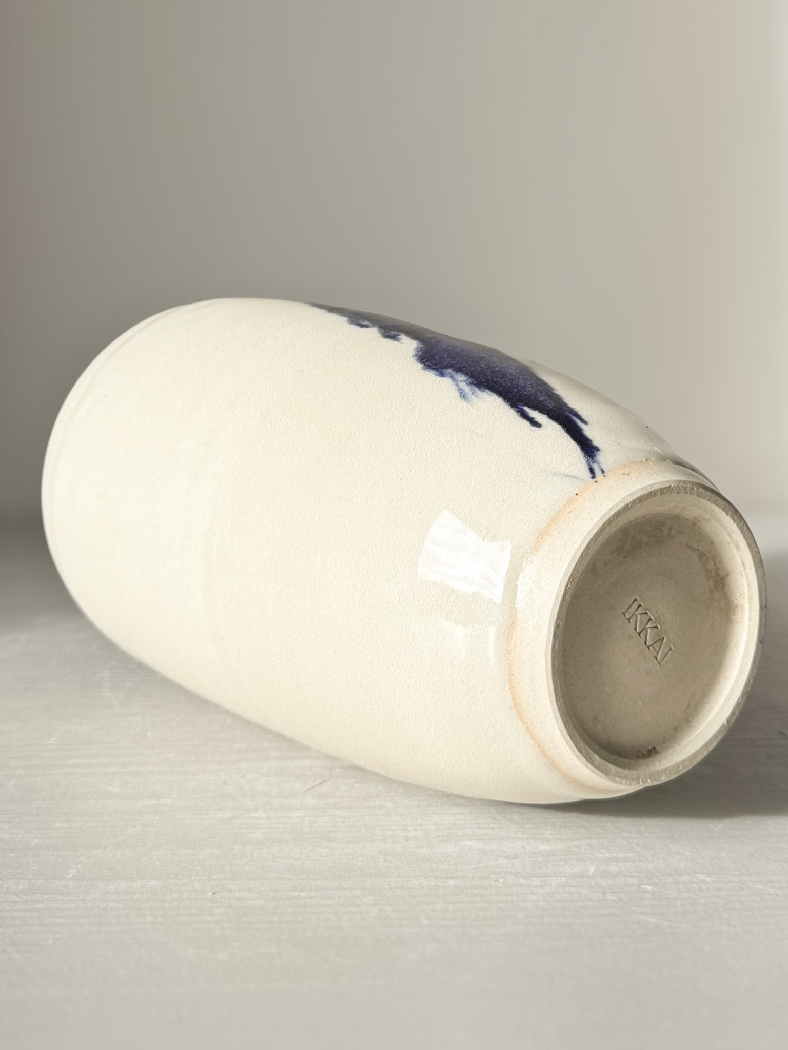 Ceramic Vase - Gosu #08 with hand-splashed cobalt blue accents and glossy finish, showcasing a unique, modern design.