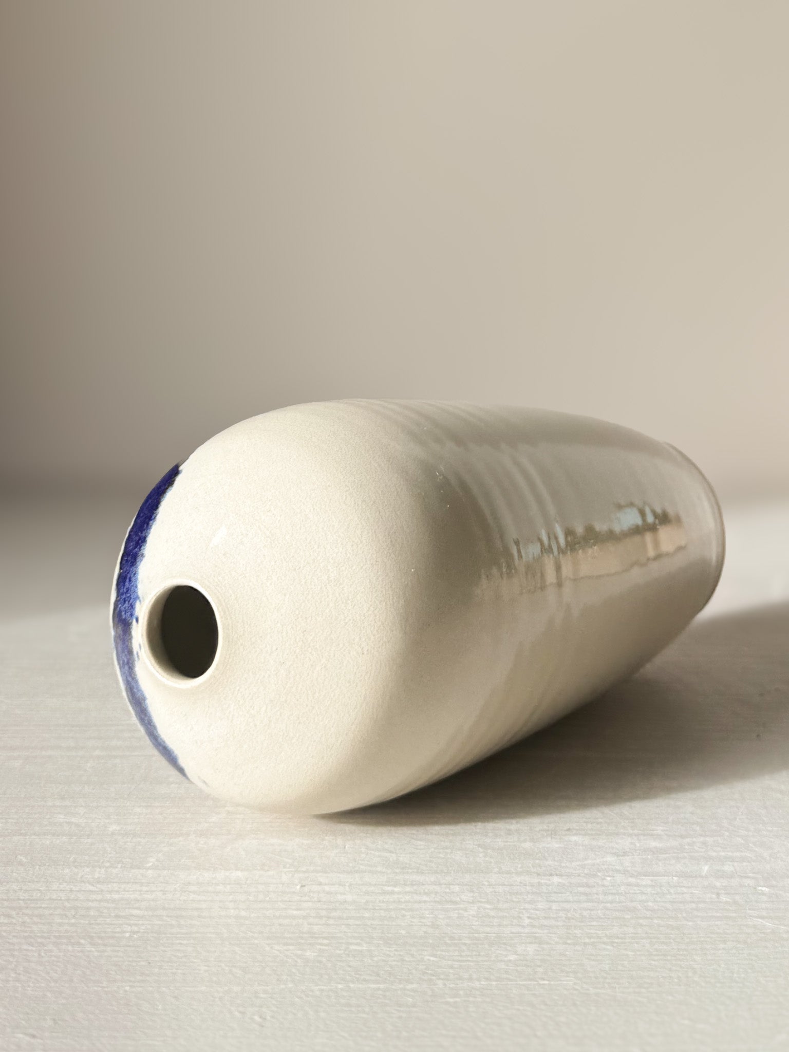 Ceramic Vase - Gosu #07 with hand-splashed cobalt blue accents and glossy glaze, unique and modern design, 17 cm tall, 8 cm diameter.