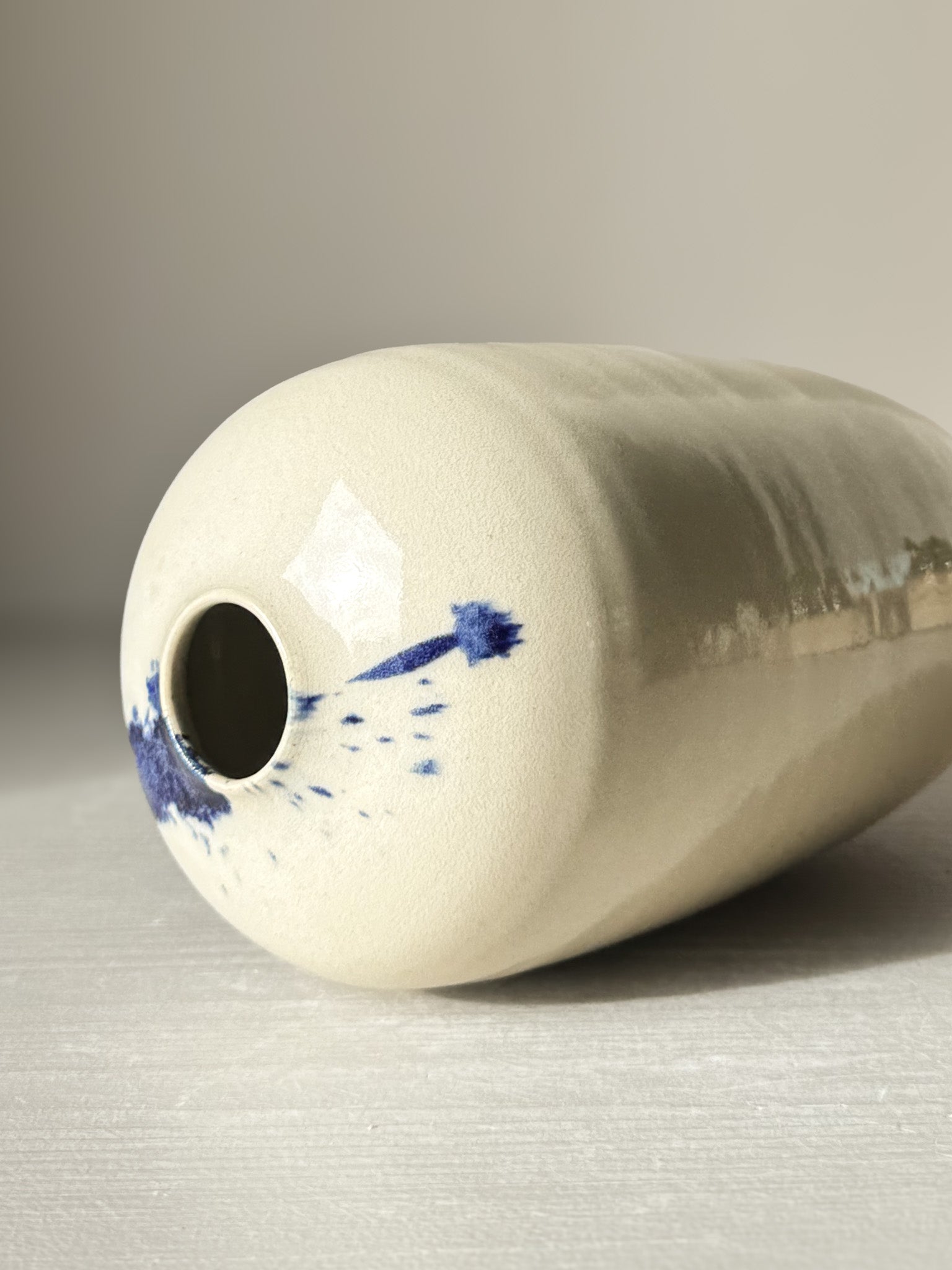 Ceramic Vase - Gosu #08 with hand-splashed cobalt blue and clear glossy glaze, showing unique artisanal design.