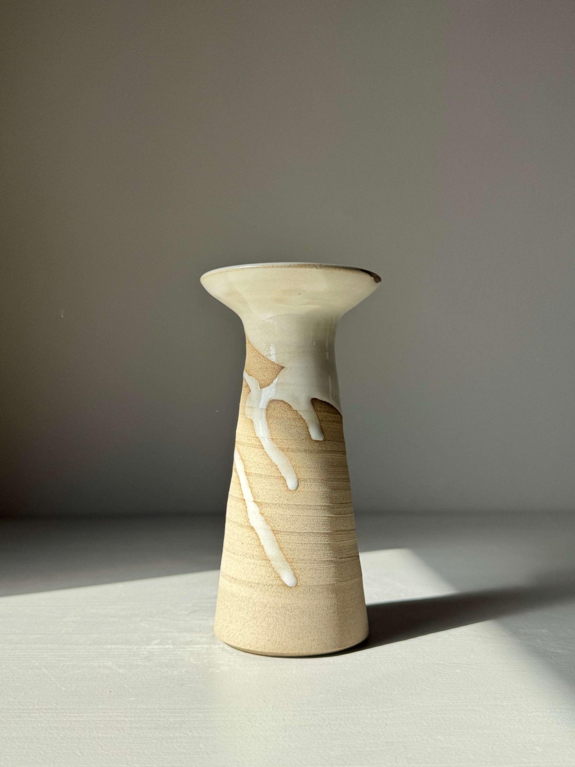 Medium Vase – Yuki Series #01, handmade ceramic with glossy white glaze and tall cylindrical shape, showcasing natural patterns.