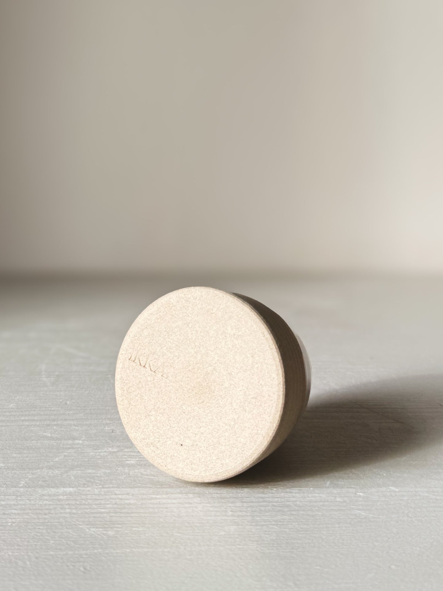 Base view of Small Vase – Yuki #02 showcasing matte raw clay finish and subtle design.