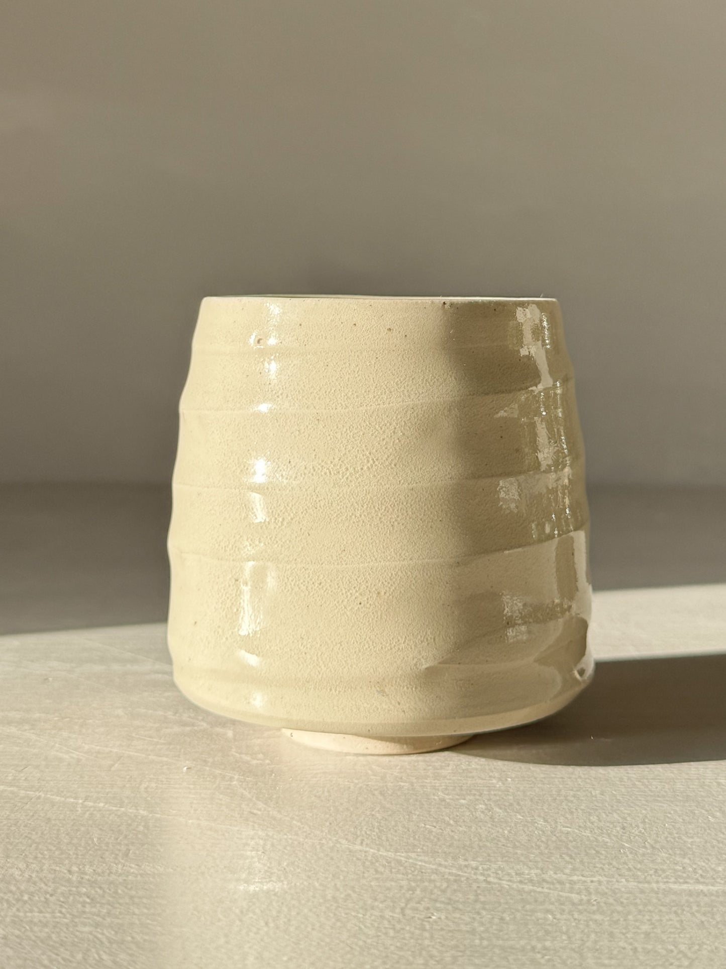 Yunomi Cups - Clear Glaze #01 with soft rounded form and subtle textured ridges, highlighting the transparent glaze and stoneware tones.