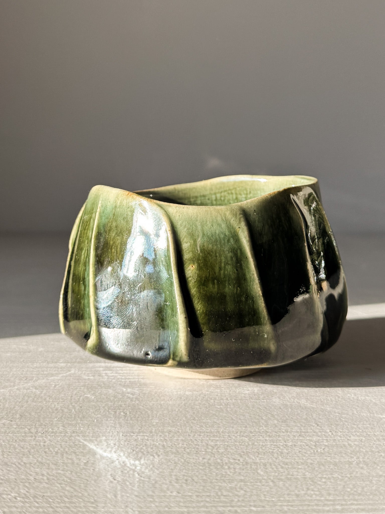 Handmade Yunomi Cup - Hinoki #01 with deep green glaze and flowing lines for everyday tea moments