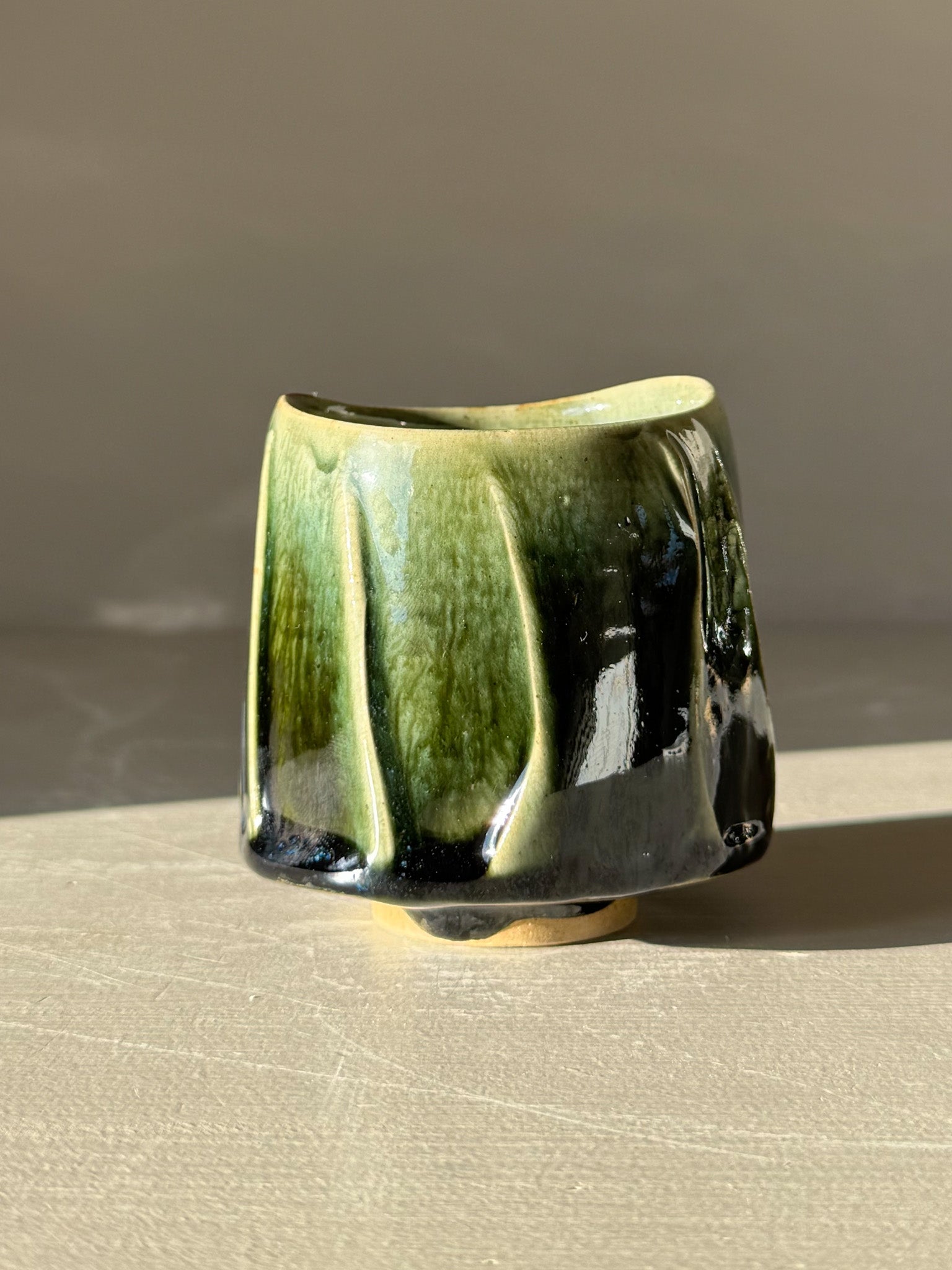Yunomi Cup - Hinoki #18 with deep green glaze and flowing slip texture on a handcrafted ceramic surface, perfect for tea moments.