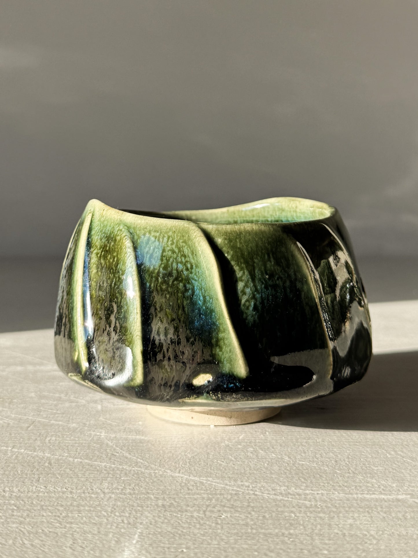 Handcrafted Yunomi Cup - Hinoki #03 with a deep green glaze and subtle textured lines on the surface.