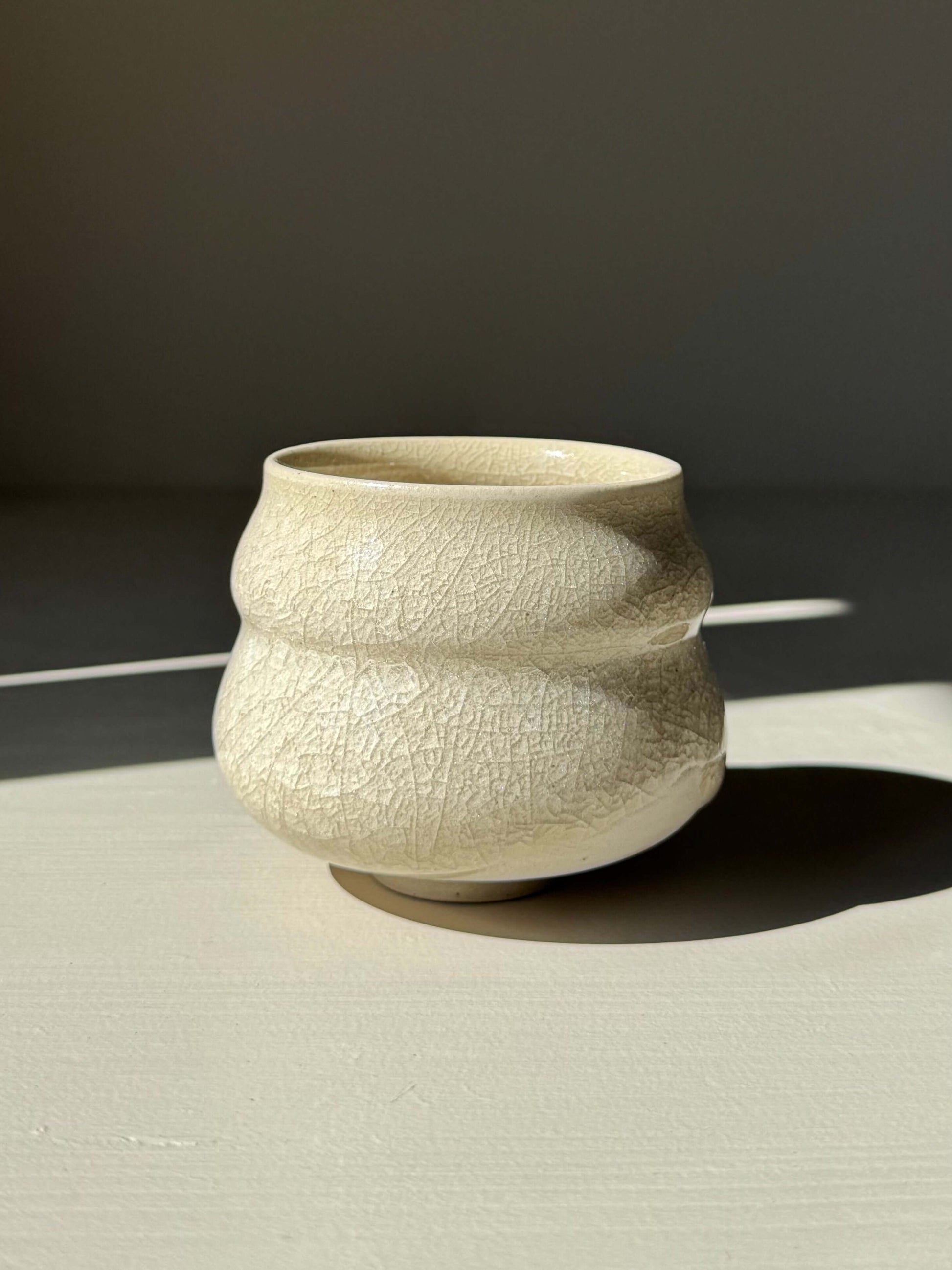 Yunomi Cup - Kannyū Series #01, handmade ceramic with a transparent crackle glaze, showcasing delicate lines and soft flowing rim design.