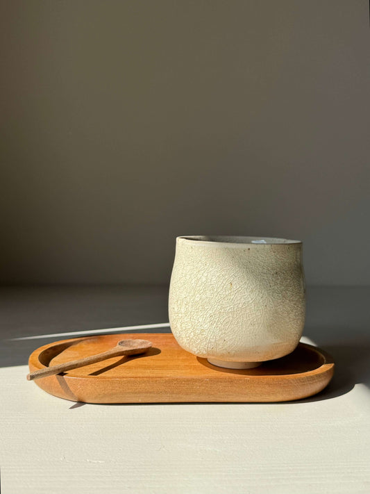 Handmade ceramic Yunomi Cup - Kannyū Series #08 on a wooden tray, featuring a textured crackle glaze and elegant compact design.