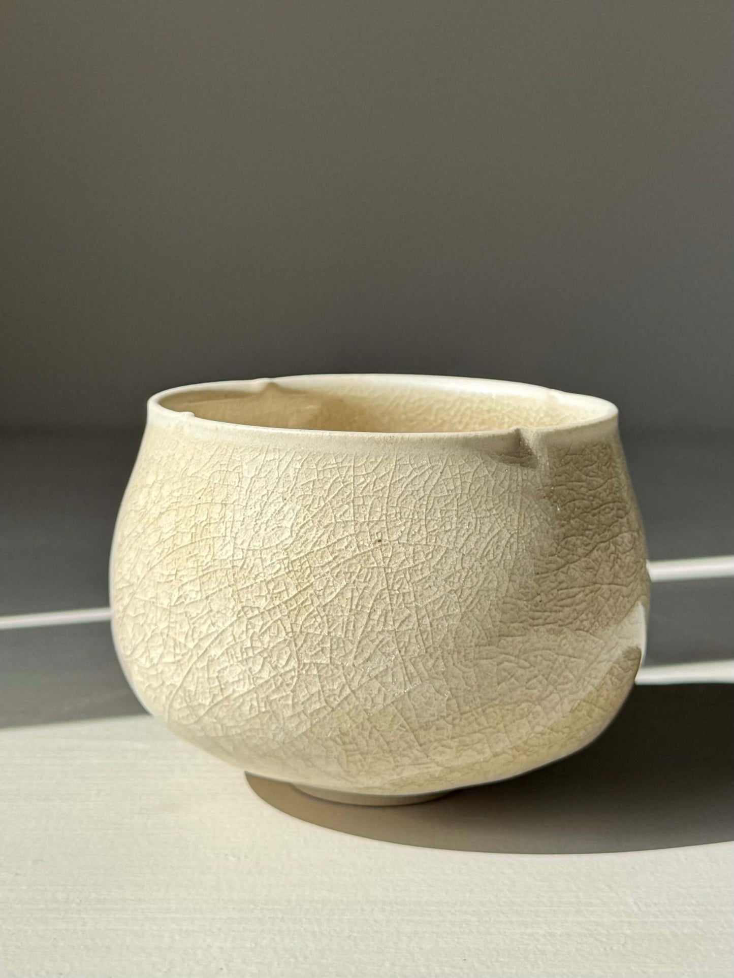 Handmade ceramic Yunomi Cup - Kannyū Series #05 with crackle glaze and softly flowing rim, ideal for everyday tea enjoyment.