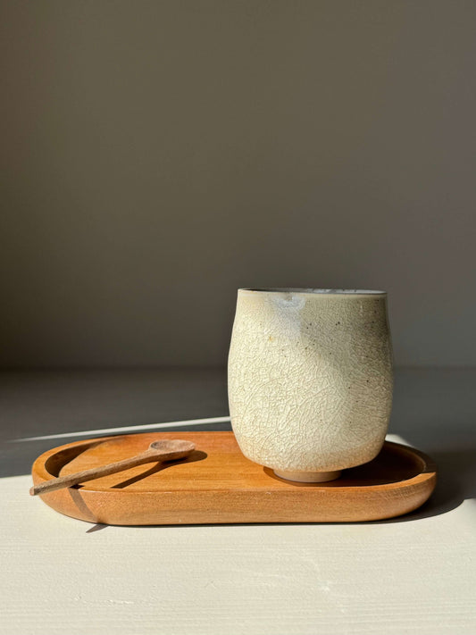 Yunomi Cup - Kannyū Series #07, handmade ceramic with crackle glaze, resting on a wooden tray.